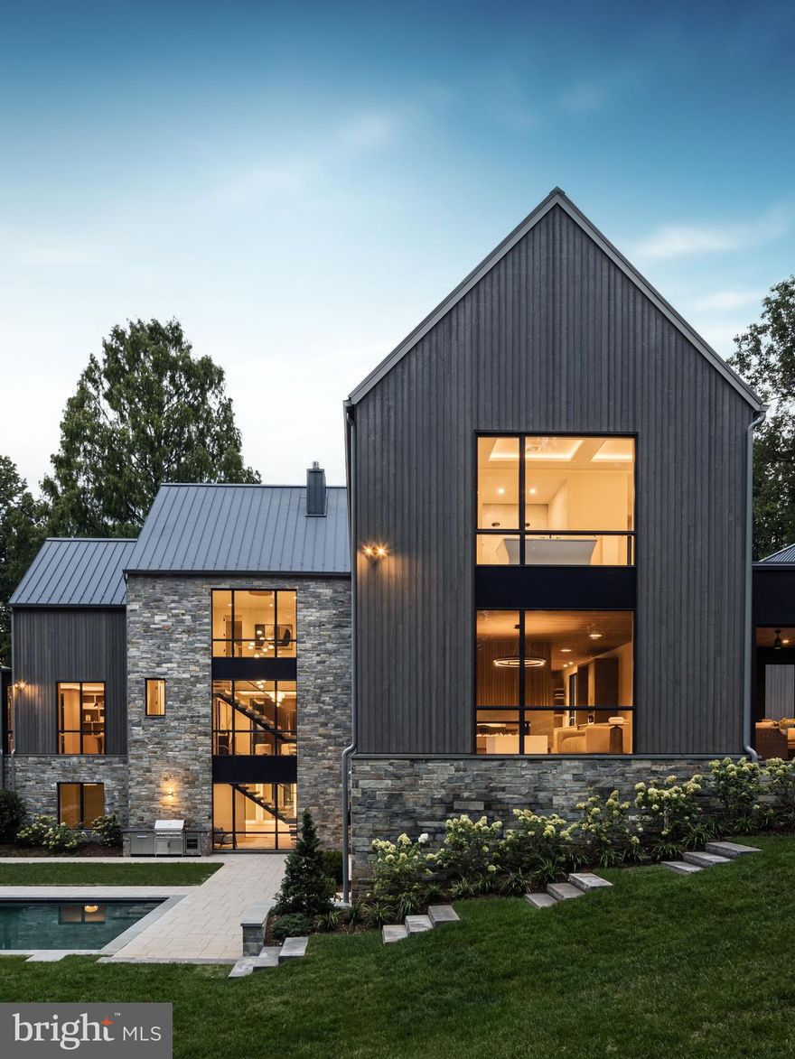 Artisan unveils a New Look for the discerning McLean Buyer.  Inspired by Traditional Scandinavian Architecture, and in conjunction with GTM Architects, Artisan Builders has crafted a Transitional new Design that will stand the true test of a Fine Home, Time!

As you approach this One-Acre private property, Artisan took care to keep the magnificent 50-year-old Dawn Redwood tree. You instantly feel that the home, while new, may have always been here.

This same care and appreciation were taken in crafting 7216 Dulany Dr. 

As you walk the property you perceive the random blue-stone bricks, meticulously cut, and laid by a master mason.  To compliment this unique stone design, Artisan selected Shou Sugi Larch Siding, a beautiful, sustainable, long lasting, and durable veneer. The finishing touch is an Englert Slate Grey Standing Seam Metal Roof. This “cool metal roof” plays a pivotal role in energy efficiency, is low in maintenance and has a service life of 50 Years.

Proceeding to the backyard, Fine Landscapes of McLean designed a pool, landscape and recreation scheme to keep you entertained, year-round.

Of course, once inside, the Artisan team, known for its refined craftsmanship and elegant taste, delivers, but don’t take our word for it, come preview it yourself, Now!