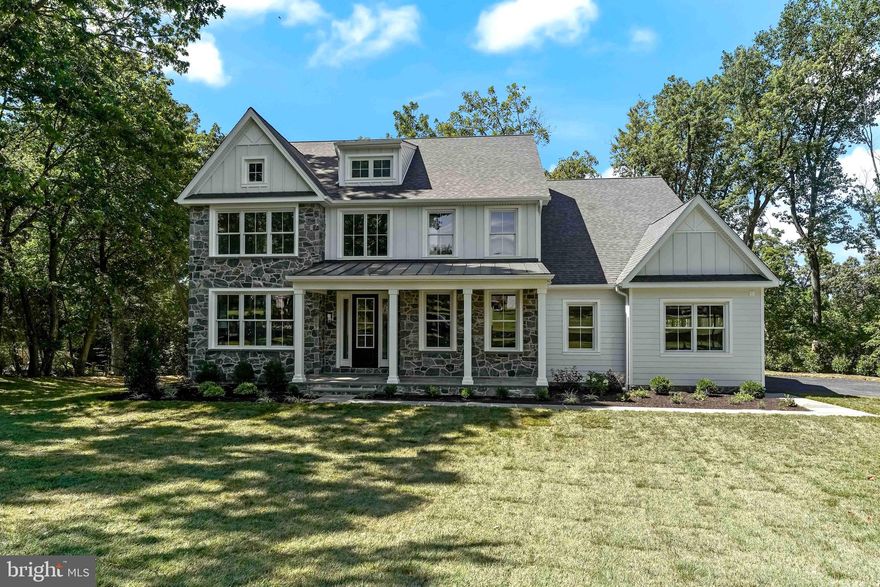 ULTRA-RARE opportunity to own BRAND NEW CONSTRUCTION w/ ELEVATED FINISHES in PENN VALLEY / LOWER MERION TOWNSHIP just completed by one of the Main Line's most respected Master Builders -- SPOSATO HOMES! This Sun-Drenched Modern Colonial Farmhouse is perfectly nestled on Tower Lane, one of Penn Valley's most desired, NO-THROUGH, QUIET, TREE LINED STREETS!  Set on a beautifully landscaped .71 acre lot w/ serene views of nature, yet just minutes to the center of Narberth (R-5 Train to Center City, Shopping, Restaurants, Theater, Park & Library) + STEPS to highly acclaimed Welsh Valley Middle School and part of the nationally recognized LOWER MERION SCHOOL DISTRICT! This 5 Bedroom 4 1/2 Bath 4,168 +/- sq. ft home offers DESIGNER SOURCED HIGH END FINISHES paired with an OPEN CONCEPT FLOOR PLAN, TALL CEILINGS & CIRCULAR FLOW boasting a variety of amazing spaces flooded with natural sunlight that harmoniously connect the serene natural setting and the modern interior creating great indoor-outdoor flow. The flagstone walk and covered front porch (w/ Beadboard ceiling and lighting) lead to the Gracious 2 Story center hall entrance w/ Site-finished gleaming 3/4” white oak hardwood floors flanked on either side by the Formal Living Room w/ triple window, wide baseboard & crown mouldings & the Large formal Dining Room w/ accent wall of wainscoting accessing the Butlers Pantry w/ quartz counters and backsplash, wet bar, wine refrigeration & walk-in outfitted pantry. The heart of the home is the INCREDIBLE CHEF'S DREAM KITCHEN w/ BEAUTIFUL CUSTOM White Soft-Close Maple Cabinetry w/ stunning Quartz Counters & Large Entertaining Island & TOP OF THE LINE APPLIANCES including: WOLF (6) Burner Gas Range w/Griddle & Double Ovens, XO Professional Hood, SUBZERO Refrigerator/Freezer, Bosch Dishwasher, Sharp built-in microwave drawer, Deep Stainless sink w/ Air Switch disposal & Sprayer OPEN to the LARGE Breakfast Rm w/ 3 Walls of Windows & sliding door to Large Timbertech Maintenance Free Entertaining Deck w/ Steps to the SERENE PRIVATE YARD (Perfect for BBQ's, Outdoor Entertaining & Dining Al Fresco). The LARGE FAMILY ROOM w/Coffered Ceiling & Gas Fireplace seamlessly connects to the Kitchen for Entertainment Perfection! Completing the 1st floor is a Private Home Office and a separate Family Entrance w/outfitted Walk-In Closet, Built-In Cubbies w/Shiplap Walls, hooks and storage shelves & Guest Powder Rm w/ Porcelain Tiled Floor and Floating Vanity off the OVERSIZED 3 CAR GARAGE!  The beautiful open staircase & Sun-Lit 2nd floor landing lead to the PRIVATE SUMPTUOUS OWNERS SUITE w/Tray Ceiling, Triple Window w/ Western Exposure, 2 LARGE WALK-IN OUTFITTED CLOSETS & AMAZING SPA-LIKE Bath w/Massive Porcelain Slab Floors, Antiqued Gold Fixtures, Double sinks w/Quartz counters, Large Frameless Shower w/ Intricate Marble Basket Weave Floor, Bench, Rain Shower & separate handheld diverter, Deep Soaking Tub w/ Spigot filler & Private water rm.  Outside of the Owners Suite is a Full Laundry Rm, 4 Add’l Bedrms incl. 2 Ensuite BR's w/ Walk-In Closets & Designer Baths (one a frameless stall shower and the other w/ Tub/Shower) + 2 Add’l Bedrms w/ Walk-In Closets and a shared Jack & Jill Bath w/ Dual Sink Quartz Vanity and SEPARATE room w/ Tub/Shower & toilet. The Day-Lit WalkOut lower level offers Tall Ceilings and the ability to add an additional 1400 sq ft of finished living space - can include EnSUITE BR #6 (au-pair/guest rm w/ Full Bath), playroom, gym, wine cellar and/or media room.  This level walks out to the flat rear yard and has storage and utilities.  Additional features of this home include: Maintenance Free Exterior, Anderson Doors and Windows, 2 Zone High Efficiency HVAC, designer light fixtures, upgraded Mill work, recessed Lighting, 3 Car Garage, Professional Landscaping (sod, plantings and landscape boulders)+  LOWER MERION SCHOOLS & HIGHLY REGARDED SPOSATO HOMES make this VERY SPECIAL UNICORN HOME ONE NOT TO BE MISSED