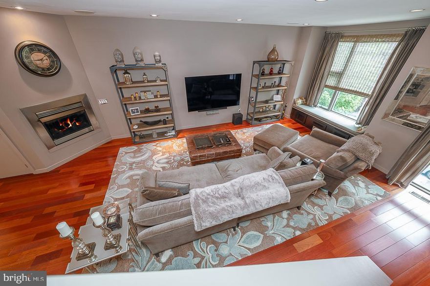 2 Car Garage!! Welcome to this extraordinary, meticulously maintained 3-bedroom, 3-bath home nestled in one of the most sought-after neighborhoods—just steps from the Art Museum, Kelly Drive, Fairmount Park, and some of the city’s best restaurants and shops! This fantastic newer construction, 3000 square foot home is packed with luxurious features and thoughtful upgrades throughout. Step inside to a welcoming foyer with elegant marble flooring, leading to a spacious first-floor bedroom with a private ensuite bath—perfect for guests or a home office. This level also provides interior access to the oversized two-car garage and the fully finished basement, ideal for a media room, home gym, or play area. The second floor stuns with a light-filled open layout. The chef’s kitchen features rich espresso cabinetry, sleek stainless steel appliances, granite countertops, a glass tile backsplash, and a large granite breakfast bar, opened to a stylish dining area with a dramatic new built-in mirror that elevates the space. The living room boasts high ceilings, a cozy gas fireplace, recessed lighting, gleaming hardwood floors, and a large picture window with a custom window seat that floods the space with natural light. On the third floor, the primary suite offers a serene retreat with a spacious bedroom, a luxurious ensuite bath featuring a double vanity & a large walk-in glass shower, and great closet space. The generously sized second bedroom includes a large walk-in closet and there is a full hallway bath. Head upstairs to the show-stopping roof deck, offering breathtaking panoramic skyline views—perfect for relaxing, entertaining, or enjoying a sunset over the city. This rooftop oasis is the cherry on top of an already impressive home. Additional upgrades include: a new Lennox HVAC dual zoned system, wireless Sonos sound system throughout, upgraded electrical panel & circuit breakers, remote thermostat, and wall protectors behind all doors. Don’t miss this rare opportunity to own a one-of-a-kind home in an unbeatable location, combining comfort, style and city living at its finest. (The first few photos are virtually staged).