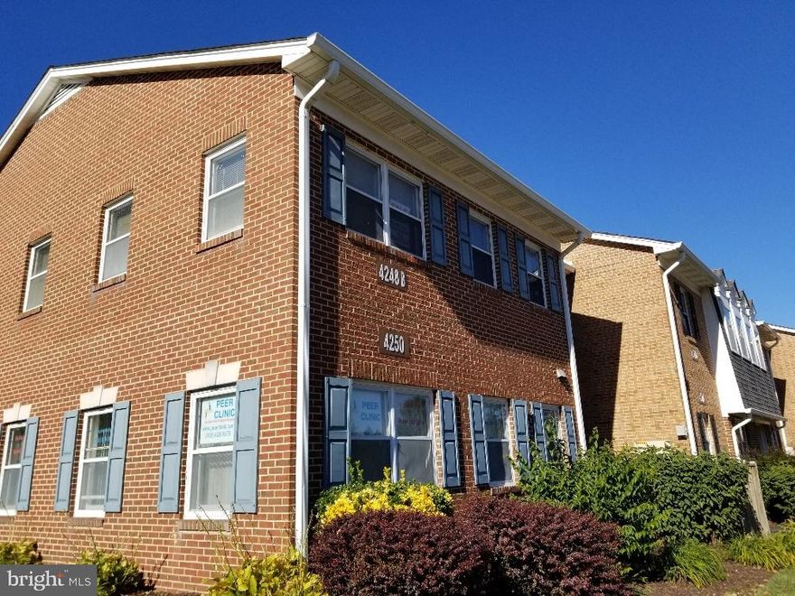 The property is situated within the heart of Fairfax, VA, located along the well-traveled Chain Bridge Road corridor. This prime location benefits from its proximity to major transportation arteries, government institutions, and a thriving commercial and residential base. The 2nd floor unit totals 910 SF. The site, built in 1979, has been well maintained. The  unit contains a reception area, multiple private offices, and multiple bathrooms. The property conveys with an abundance of free surface parking available on-site. 

Fairfax is an independent city and serves as the county seat of Fairfax County. It is a dynamic business hub that blends historical charm with modern commercial developments. The city is home to numerous government offices, financial institutions, and technology firms, benefiting from its strategic location just 17 miles west of Washington, DC. Notable employers and institutions in Fairfax include George Mason University, Fairfax County Government, Inova Health System, and numerous federal contractors.

The subject property enjoys excellent accessibility via Routes 123 and 50, as well as I-66, a key commuter route connecting Fairfax to the greater Washington, DC metropolitan area. Additionally, the Vienna/Fairfax-GMU Metro Station, located just a short distance away, provides convenient public transportation options via the Orange Line. The continued expansion of transit-oriented developments and infrastructure improvements have further enhanced Fairfax’s appeal as a prime business and residential destination.

Fairfax has experienced steady economic and population growth, making it a highly desirable market for retail, office, and mixed-use developments. The surrounding area features a diverse mix of retail centers, restaurants, and entertainment venues catering to a strong local demographic. Nearby national retailers and dining establishments include Walgreens, T.J. Maxx, Noodles and Company, Giant, Dunkin’ Donuts, Safeway, and Outback Steakhouse.

With a city population of approximately 24,000 within Fairfax and over 1.1 million residents in Fairfax County, the property is positioned in an area with strong consumer demand, affluent demographics, and a robust business environment. Future developments and infrastructure projects continue to drive interest in the Fairfax market, making it a premier location for businesses looking to establish a presence in Northern Virginia.