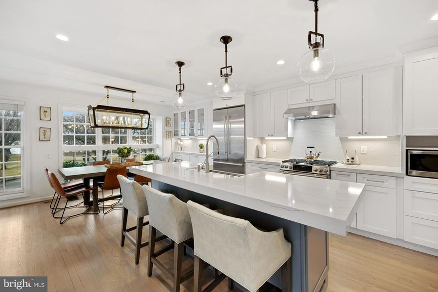 Enjoy living in the heart of old town and waterfront views from this 2500 sq ft renovated end townhome. Overlooking the Potomac River, Founders Park and the new RiverRenew Promenade (currently under construction), sits this sunfilled home.  Enjoy your morning coffee watching the water taxis headed to DC and your evening with the sparkling lights of National Harbor's Ferris Wheel and the Woodrow Wilson Bridge .   With 3 parking spaces, 4 Bedrooms, 4 Baths, plus large fenced outdoor entertaining area, this home is a rarity in Old Town.  Host friends and family in the open chef's kitchen with its designer light fixtures, gas cooking, large center island & dining table.  Warm up by the fire in the adjoining the living room with 10 ft ceilings.  Step outside to the expansive patio with grilling area and enjoy the large fenced yard.  Plenty of yard for the kids and dog to play.  A home that fits every criteria of water views, outdoor patio space and parking and with EV charger.  Enter the foyer with wide plank floors, exceptional lighting and recently installed custom stair runner. The main and upper levels offer hardwood floors.
 The lower level bedroom suite has a private separate entrance  The access can be separated from the other floors, if desired.   There are 3 additional bedrooms and baths on the upper levels.  The top level with its expansive river views offers a bedroom, bath and additional family room.   A turn key home  for those wanting lock and leave with no HOA in an exceptional location.
Please see floorplan in documents