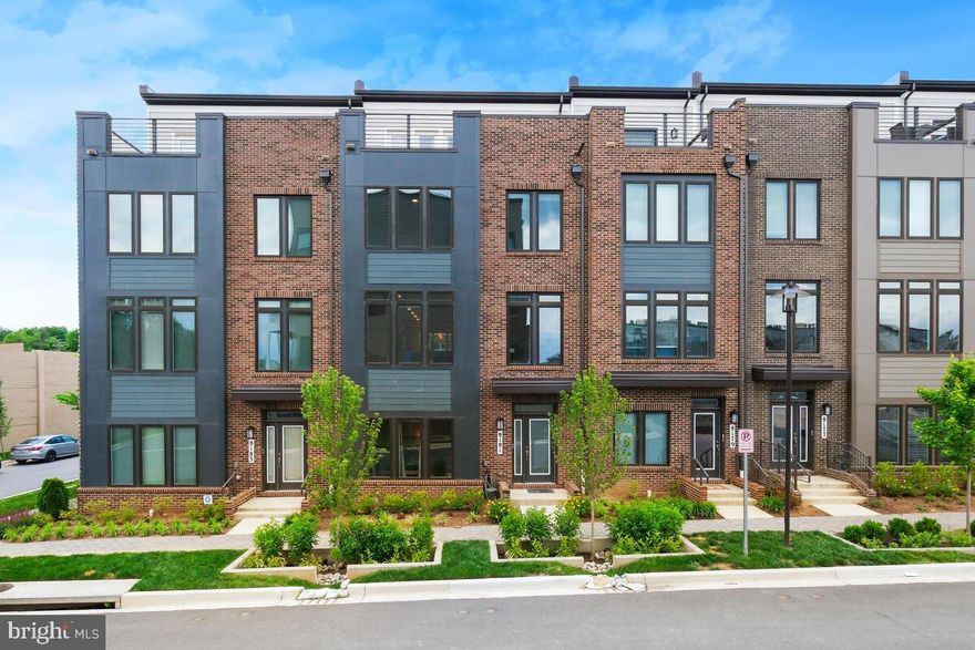 Welcome to 8181 Front St, where modern luxury meets convenience in the heart of Westside at Shady Grove. This breathtaking newly built 4-level townhome spans over 2,900 square feet and features 4 bedrooms, 3 full bathrooms, and 2 half bathrooms. Every detail of this home has been meticulously crafted to perfection, with over $60,000 in builder upgrades, plus additional homeowner upgrades including luxury ceiling fans and custom window blinds. The open gourmet kitchen on the second level is a chef’s dream, equipped with an oversized center island, top-of-the-line stainless steel appliances, a double oven, a gas range, and a designer backsplash. The kitchen flows seamlessly into the dining area and steps onto a patio with a sitting area, perfect for morning coffee or evening relaxation. The entire second level is flooded with light from oversized windows and recessed lighting, creating a warm and inviting atmosphere. The dining area transitions smoothly into the living area, featuring a gas fireplace for those cozy nights in.
On the entry level, you’ll find a bedroom and a full bathroom, providing privacy and convenience for guests or a home office. The third level houses the primary bedroom with a luxurious primary bathroom, complete with a double vanity, as well as two additional bedrooms and the third full bathroom. The fourth level offers a large versatile space perfect for entertaining, complete with a wet bar and an outdoor patio ideal for gatherings. This home also includes a 2-car garage with an EV charger, catering to your modern needs. Relax in the stunning clubhouse, which boasts an outdoor pool, a state-of-the-art fitness center, cozy firepits, and outdoor grills. Located within walking distance to shops, dining, and the metro, and a short drive from Downtown Crown and Rio Lakefront, this home truly embodies the epitome of convenient luxury living. The home is walking distance to Starbucks, CVS, and Giant, with many fine dining and shopping just minutes away. Quick access to I-270, 495, and 200 makes commuting a breeze. Schedule your tour today!