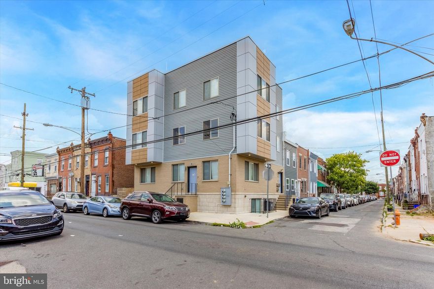 New Construction Three-Unit Apartment Building For Sale in Downtown Philadelphia. Ideal for Owner-User or as an Investment. The first-floor unit is Approx +/-1,775 sqft, has two levels, and can be used as either commercial or residential space. The second and third-floor units are large 2-bedroom residential apartments with a rooftop terrace. Cap Rate: 8%, with expenses estimated at $5,000 Year and income estimated at $80,400 Year. Locked-in Tax Abatement through October 31, 2030. The seller can sell the property vacant or occupied. Each Unit utilities are metered separately. All units feature modern kitchens with beautiful quartz countertops and large quartz islands, complemented by sleek stainless-steel appliances that enhance the contemporary tone. Unit One, most recently occupied by a community daycare center, is a bi-level unit with 2 private rooms, 1 bathroom (with a soaking tub and attached shower) a kitchen as described above, and access to a private yard. The lower level contains 2 additional private rooms, a large multi purpose room/area and 2 bathrooms, both with large showers. Laundry facilities are also conveniently located on this level. Units 2 and 3 each contain 2 ample-sized bedrooms, 2 full bathrooms (both with soaking tubs and attached showers), and the modern kitchen. The rooftop deck features a panoramic view of the city skyline and is enhanced with stylish light fixtures and speakers, creating the perfect ambiance for relaxation or entertaining guests after sundown. All three units include front-loading washers and dryers, central air, modern kitchens, natural sunlight, and ample closet space. Walking distance to top-rated medical facilities, tech industry hubs, educational institutions, and all city amenities and conveniences. A 10-minute drive to Philly Sports Venues and I-95 with easy access to New York, Delaware, and New Jersey.