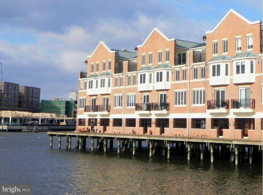 Spectacular outer harbor views from every window in this perfectly sited pier home on the water! Handsomely updated in 2005 top-to-bottom featuring gourmet Kitchen w/ granite, custom cabs & stainless appliances plus hardwood floors on Main Level. Marble baths & incredible custom closets. 2 car secure covered parking.  Immaculate condition!