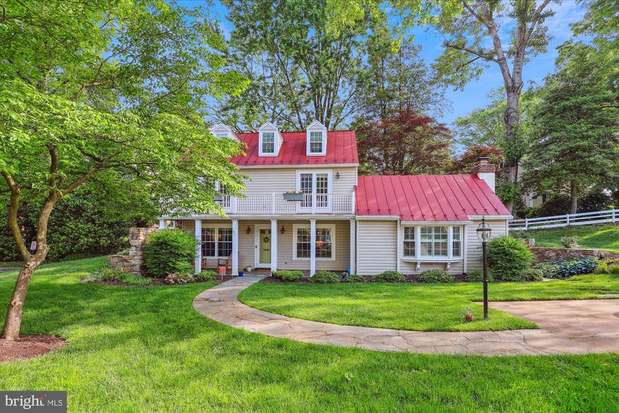 This *BEAUTIFUL* renovated/expanded cottage/carriage-style home built in 1860 in Falls Church City sits back on a lush quarter acre+ lot with a stone walkway leading to the picturesque front porch area - perfect to relax on summer evenings.  Enter the main level and embrace the history of this home with a beautiful stone wall and wood burning fireplace in the living room with ceiling timbers. The updated kitchen features an eat-in area with quartz countertops, ample counter/storage space and stainless-steel appliances. Completing this level is a spacious family room (or 3rd bedroom) with a cathedral ceiling, wood burning fireplace, and built-ins with access to the private back patio. Additionally, there is a separate entrance to the front porch area from the family room. The upper level offers two spacious bedrooms, a full bathroom, and a half bath separating the two bedrooms. One of the bedrooms has a spiral stairway to a loft area. Two bedrooms have walk-in closets, and the laundry is located on this level. Tucked away on a quiet street, this lovely home has a picturesque setting with lots of privacy. Located in the sought-after Hillwood neighborhood of Falls Church City, this home offers very close proximity to the heart of the city with restaurants, shopping, WO&D trail, and quick access to commuter routes. This home was expanded in 1981 and renovated in 1978. Enjoy this wonderful community and Falls Church City Schools!