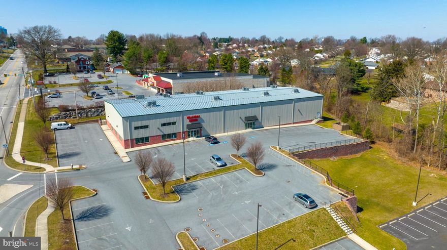 Come take a look at this well-built industrial/recreational building just off of the US Route 30! Built from the ground up in 2014! As currently configured, the 18,480 sq ft. building is split almost evenly between retail space and sporting/recreational space. The retail space provides a large reception area, several existing offices,  bathrooms, changing rooms, and kitchenette. Currently containing store inventory and shelving/display counters for sport products. An additional mezzanine overlooks this part of the building, and could be expanded on. The 2 additional spaces contains professional volleyball court space with 26 ft. clear heights and a dedicated entry/vestibule to each court room, with a mezzanine for each.  Courts have been upgraded with  brand new LED lighting, and Sport Court Flooring.  Additional 2 bathrooms exist for this recreational space.  Full interior access exists between the retail and recreational spaces in the event of a single-user. However, separate entry and interior steel doorways separating the two spaces could allow the  building to accommodate more than one tenant if desired.  The parking lot has parking for 120+ cars, with room to expand if need be. Potential uses could be retail, shipping, industrial, warehouse, or even join the pickle ball craze of 2022! Add this to your list of commercial properties to see this year.