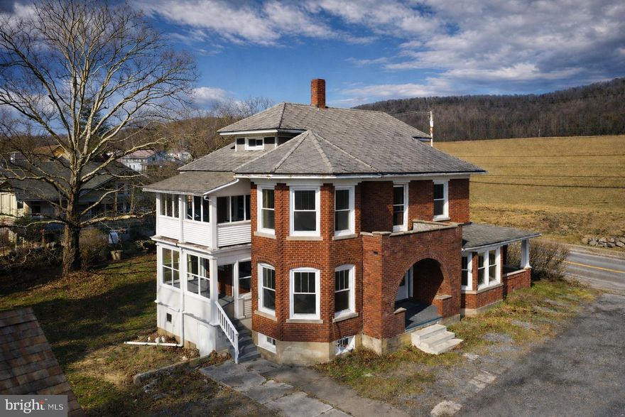 Fall in love with this beautifully maintained 1900’s brick home offering over 1,900 square feet of living space, perfectly designed for comfort and everyday living. This inviting property features 3 spacious bedrooms and 2 bathrooms (1 full and 1 half), making it an ideal fit for families or anyone looking for room to grow.

Step inside and enjoy the charm of original maple hardwood floors flowing throughout the downstairs of the home and original pine flooring upstairs. There is a top-of-the-line kitchen that has granite countertops as well as custom made cabinetry. This beautifully upgraded kitchen is both stylish and functional — perfect for cooking, entertaining, and gathering with family and friends.

There are 2 sets of pocket doors downstairs to allow for an open living concept or the ability to separate rooms. There is a new washer and dryer on the first floor as well.

In addition to the living areas there is a full walk-up attic and a full basement.

One of the home’s most charming features is the four covered porches, offering multiple spaces to relax and enjoy the outdoors. Upstairs features two covered porches, including a “sleeping porch” off the master suite, perfect for enjoying quiet mornings or cool summer evenings.

The home has been thoughtfully updated with new windows throughout, bringing in plenty of natural light while improving energy efficiency.

Outside, you’ll find a huge backyard offering endless possibilities for outdoor entertaining, gardening, or simply relaxing in your own private space. The lot on the west side of the home is deeded separately and is included in the current purchase price of the home. The property also includes an oversized garage, providing excellent storage, workspace, or room for multiple vehicles.

Well cared for and move-in ready, this home blends character, modern updates, and generous space both inside and out. Homes offering this much space, charm, and outdoor living rarely come available — schedule your private showing today.