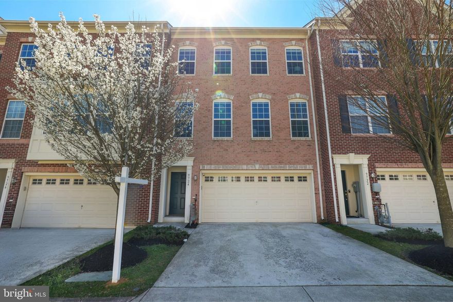 *MULTIPLE OFFERS RECEIVED - DEADLINE MONDAY 4/1/24 | 5 PM* Introducing an exquisite residence at 9724 June Flowers Way, nestled within the prestigious Emerson community. This masterfully renovated townhome is a testament to luxury living, boasting a kitchen of commercial caliber, replete with enhancements that would delight even a Michelin-starred chef. Enjoy tranquil pond views from the elegantly appointed TRX deck, alongside the allure of brand new carpeting and paint throughout, elevating the ambiance of sophistication.

The exterior presents a dignified brick façade, complemented by an inviting portico and a generously sized two-car driveway, setting the stage for an unparalleled welcome. Upon entry, the foyer unfurls into a formal living space, where polished hardwood floors, soaring ceilings, and Hunter Douglas silk window treatments converge to craft an opulent atmosphere. The formal dining room is graced with tray ceilings and a newly installed crystal chandelier, further enhanced by hardwood floors and chair rail molding, embodying the essence of refined elegance.

Entertain with unparalleled flair in the spectacular kitchen, featuring custom 42” Snow White cabinetry with glass showcases, soft-close mechanisms, and discreet under-cabinet lighting. The suite of high-end, commercial-grade appliances includes a 36” Dual Fuel Wolf Range, a 1300 CFM Zephyr Titan Hood, and a robust 1 Horsepower Garbage Disposal system, among others. Finished with Luxury Vinyl Tile flooring and premium granite countertops with bull-nosed edges, this kitchen is a culinary dream.

The private balcony, accessible from the kitchen, offers a serene retreat with TRX planking and picturesque pond views – ideal for morning reflections or evening grilling. The family room, anchored by a gas fireplace and gleaming hardwood floors, along with a conveniently located half-bathroom, completes the main living area.

The upper level is home to the owner’s suite, a sanctuary of peace featuring high ceilings, Hunter Douglas silk window treatments, a walk-in closet, and an en-suite bathroom with a walk-in shower and a luxurious soaking tub. Two additional bedrooms, replete with new paint and carpet, share a full bathroom and a laundry area, rounding out the living quarters.

The expansive lower level includes a large fourth bedroom with an en-suite bathroom and dual access to the garage and the walk-out basement.

The Emerson Community offers a wealth of amenities, including two swimming pools, tennis courts, pet stations, playground areas, pavilions, a clubhouse, parks, and walking paths. Positioned in the blue ribbon Howard County school district and strategically located between Baltimore, MD, and Washington, DC, this residence promises a blend of tranquility and convenient access to major highways like Rout 29, 32, I-95, Baltimore, Washington DC, Annapolis, Fort Meade, and Columbia.  Restaurants and shops are a short drive away to Maple Lawn. Transit: Central Maryland Regional Transit (CMRT) bus service runs in nearby Savage and Laurel. MARC commuter rail stations in Savage and Laurel are short drives away, as is commuter bus service in the Maple Lawn section of Fulton.