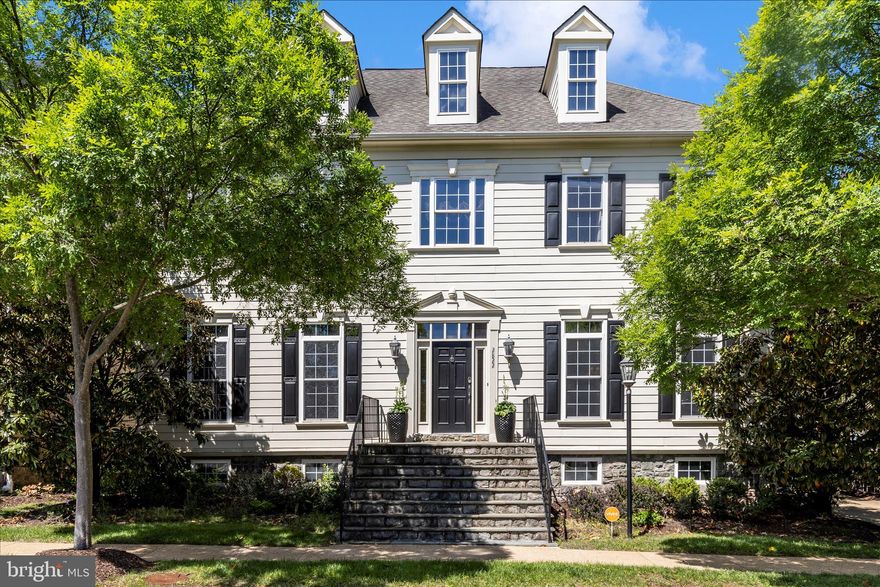 In the heart of Oakton, in walking distance to shops, and enjoy your home which is  extraordinary! Positioned within the coveted Oakton Village community, this magnificent residence has been elevated through an impressive collection of upgrades that set it apart within the neighborhood. Arriving via one of only a few PRIVATE DRIVEWAYS in the community — easily with space for five vehicles — signals immediately that what awaits inside is something genuinely different.
Hardwood floors usher you through the 2-story foyer and into the main living spaces, where thoughtful details reveal themselves at every turn: plastered walls in the living room, a custom-crafted library door, and bespoke window treatments that frame the natural light. A formal dining room and separate breakfast area give the main level both the grace to entertain and the warmth for everyday living. 
The kitchen is the undisputed heart of the home — and a legendary one at that. It served as the backdrop for a filmed episode of Emeril Lagasse's culinary show. Brown marble countertops, travertine floors, a wet bar, and premium GE Monogram appliances make this kitchen as inspiring to cook in as it is to gather around. The adjoining family room carries that same design ambition, with an interlaid travertine and hardwood floor, coffered ceiling, and custom built-ins.   A Waterworks powder room rounds out the main level in impeccable fashion.
The curved staircase — framed by a dramatic custom tile wall — leads to a bedroom level that delivers on every expectation. The owner's suite is anchored by a 3-sided gas fireplace and appointed with a breakfast and wine bar with refrigerator, two custom closet systems, a makeup counter, and a primary bath featuring a soaking tub, separate shower room, double vanities, and private water closet. Three additional bedrooms each offer their own distinct character, with upgraded bathrooms throughout — one ensuite, two sharing a Jack-and-Jill. The bedroom-level laundry room, with its counter space, cabinetry, and built-in sink, is the kind of practical luxury that daily life quickly depends on.
The lower level is where this home truly distinguishes itself. A safari-themed playroom with hand-painted professional murals and a walk-in closet creates a dedicated space for creativity and play, with a handsomely upgraded bathroom just steps away. A generous mirror-walled room offers a blank canvas — home gym, yoga studio, Pilates space, dance studio, or meditation retreat. At the center of it all, the built-in bar stands ready to host: dishwasher, beverage refrigerator, kegerator, commercial ice machine, and sink, all positioned facing a large-screen home theater and bar TV powered by a super high-end rack audio system that fully conveys. Three gas fireplaces found throughout the home add warmth and ambiance on every level. Outside, a wisteria-draped pergola and WiFi-enabled outdoor speakers extend the entertaining seamlessly into the private backyard. Even the garage earns its own introduction: checkerboard flooring, built-in cabinetry, powered storage lifts, and a dedicated refrigerator make it a space guests will genuinely remember, and it is Tesla-ready.    Recessed lightnings, crown moldings, decorated columns, ceiling fans,  surrounding sound system, the list  is long.   All 6 TVs,  5 fridges, customized draperies,  home theater and surrounding sound system equipment convey.
Few addresses in Northern Virginia offer what this one does — Oakton Shopping Center and Hunter Mill Plaza are both just minutes away on foot, while Route 66, Route 50, the Dulles Toll Road, Tysons Corner, Vienna Metro, Reston Town Center, and top-rated Fairfax County public schools are all within easy reach by car.  
Luxury at this level, in a location this convenient, simply does not come available often.    Open house Sat/Sun May 16-17 1-4pm