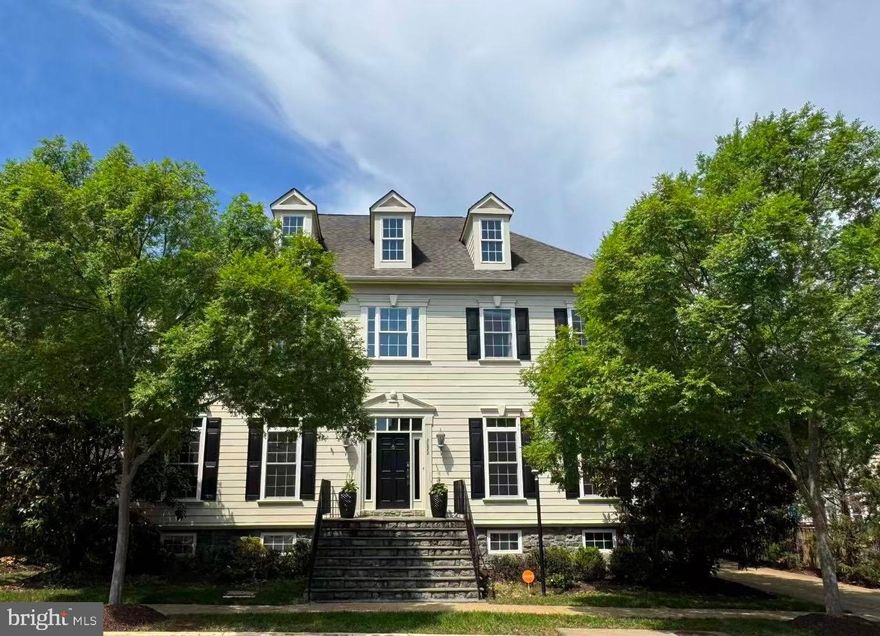 In the heart of Oakton, in walking distance to shops, and enjoy your home which is  extraordinary! Positioned within the coveted Oakton Village community, this magnificent residence has been elevated through an impressive collection of upgrades that set it apart within the neighborhood. Arriving via one of only a few PRIVATE DRIVEWAYS in the community — easily with space for five vehicles — signals immediately that what awaits inside is something genuinely different.
Hardwood floors usher you through the 2-story foyer and into the main living spaces, where thoughtful details reveal themselves at every turn: plastered walls in the living room, a custom-crafted library door, and bespoke window treatments that frame the natural light. A formal dining room and separate breakfast area give the main level both the grace to entertain and the warmth for everyday living. 
The kitchen is the undisputed heart of the home — and a legendary one at that. It served as the backdrop for a filmed episode of Emeril Lagasse's culinary show. Brown marble countertops, travertine floors, a wet bar, and premium GE Monogram appliances make this kitchen as inspiring to cook in as it is to gather around. The adjoining family room carries that same design ambition, with an interlaid travertine and hardwood floor, coffered ceiling, and custom built-ins.   A Waterworks powder room rounds out the main level in impeccable fashion.
The curved staircase — framed by a dramatic custom tile wall — leads to a bedroom level that delivers on every expectation. The owner's suite is anchored by a 3-sided gas fireplace and appointed with a breakfast and wine bar with refrigerator, two custom closet systems, a makeup counter, and a primary bath featuring a soaking tub, separate shower room, double vanities, and private water closet. Three additional bedrooms each offer their own distinct character, with upgraded bathrooms throughout — one ensuite, two sharing a Jack-and-Jill. The bedroom-level laundry room, with its counter space, cabinetry, and built-in sink, is the kind of practical luxury that daily life quickly depends on.
The lower level is where this home truly distinguishes itself. A safari-themed playroom with hand-painted professional murals and a walk-in closet creates a dedicated space for creativity and play, with a handsomely upgraded bathroom just steps away. A generous mirror-walled room offers a blank canvas — home gym, yoga studio, Pilates space, dance studio, or meditation retreat. At the center of it all, the built-in bar stands ready to host: dishwasher, beverage refrigerator, kegerator, commercial ice machine, and sink, all positioned facing a large-screen home theater and bar TV powered by a super high-end rack audio system that fully conveys. Three gas fireplaces found throughout the home add warmth and ambiance on every level. Outside, a wisteria-draped pergola and WiFi-enabled outdoor speakers extend the entertaining seamlessly into the private backyard. Even the garage earns its own introduction: checkerboard flooring, built-in cabinetry, powered storage lifts, and a dedicated refrigerator make it a space guests will genuinely remember.    Recessed lightnings, crow moldings, decorated columns, ceiling fans,  surrounding sound system, the list  is long.   All TVs,  all fridges, customized draperies and home theater equipment convey.
Few addresses in Northern Virginia offer what this one does — Oakton Shopping Center and Hunter Mill Plaza are both just minutes away on foot, while Route 66, Route 50, the Dulles Toll Road, Tysons Corner, Vienna Metro, Reston Town Center, and top-rated Fairfax County public schools are all within easy reach by car.  
Luxury at this level, in a location this convenient, simply does not come available often.    Open house Sat/Sun May 16-17 1-4pm