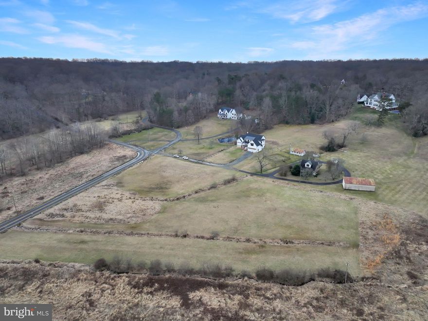 **OPEN HOUSE  Sunday, March 3 from 2 to 4**    Incredible opportunity to own like new construction on 5 acre lot less than a mile from Town of Clifton. Custom designed modern architecture home with top of the line finishes, open living space, covered front and back porches. Serene views over property acreage and to Chapel Road Park.  Custom woodwork cut and installed on site. Low maintenance exterior finishes. Stunning Great Room hosts 18' ceilings and 42" gas fireplace. Island Kitchen with stainless farm sink, GE Cafe' appliances to include 6 burner gas range with pot filler, qitonic wall oven, Energy Star refrigerator and beverage fridge. Fabulous custom designed soft touch cabinetry in kitchen plus oversized pantry area. Main level Primary Suite with cathedral ceiling, ceiling fan, walk in closet, luxury bath including soaking tub and seated shower. Three additional bedrooms and oversized loft area plus two large unfinished spaces for future exercise/music room or den.  Drop zone and main level laundry room with folding area. Over 2300 sq ft of space in unfinished walk out basement with rough in for full bath and wet bar.