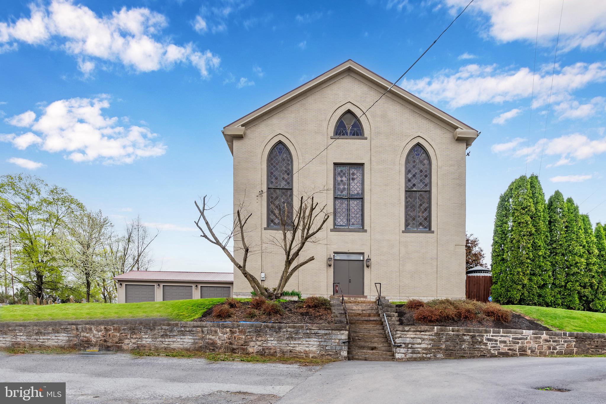 🔔 Historic Church Turned Artistic Retreat – Modern Elegance Meets Rural Charm
Looking for a property that inspires? Discover this breathtaking transformation of a former UCC church into a one-of-a-kind masterpiece. Whether you're dreaming of a peaceful rural residence, a weekend retreat, or a creative business opportunity, this architecturally rich space delivers unmatched character, flexibility, and soul.
From the moment you step through the front doors, you’ll be swept away by the blend of historic craftsmanship and contemporary luxury. Brazilian Cherry hardwood, tumbled travertine, and custom inlays create a warm and inviting welcome.
The great room features vaulted box-and-beam ceilings, artistic textures, and an open concept perfect for entertaining, creative events, or simply relaxing. The chef’s kitchen is a showstopper—complete with marble counters, a large island, ornate details, and a 6-burner gas range for crafting meals or hosting guests.
Upstairs, the 19-foot ceilings and restored wood floors create a jaw-dropping second living space ideal for gatherings, a design studio, or event hosting. A red oak loft, stylish bedroom, and spa-like bath with a tub and Turkish travertine add even more appeal.
Detached 3-car garage with epoxy flooring provides ample space for storage, workshop use, or hobbies.
Rare, remarkable, and full of soul— this historic property offers a chance to own a piece of the past, reimagined for your future. Zoned for multiple uses (verify with township).
📞 Schedule your private tour today—and see how your dream can take shape here.