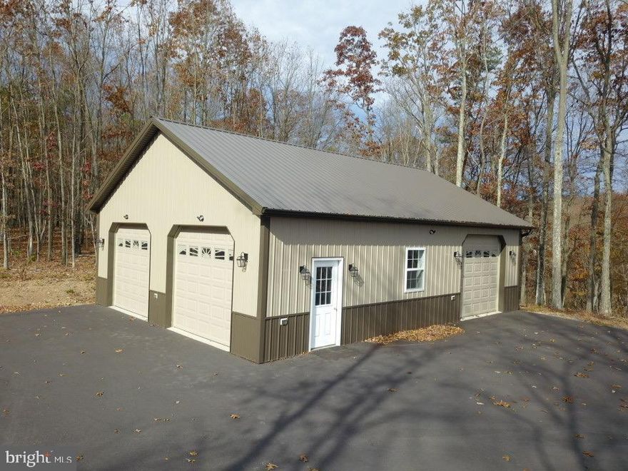 HEDGESVILLE, WV - ARE YOU CURRENTLY LOOKING FOR THAT PERFECT SITE TO BUILD YOU “DREAM HOME”? LOOK NO FURTHER!!  READY-TO-BUILD (5 ACRE) FULLY LANDSCAPED “CHOICE LOT” IN THE PRESTIGIOUS FOREST HAVEN SUBDIVISION. PRIVATELY SITUATED AS THE LAST LOT BACK. BEAUTIFUL VISTAS OF NORTH MOUNTAIN. DIRECTLY ADJOINS TO SLEEPY CREEK WILDLIFE MANAGEMENT (23,000 ACRES) FOR ENDLESS HUNTING, FISHING AND TRAILS! FULLY FINISHED (30’ X 40’) METAL LINED GARAGE W (3) 9’ X 10’ DOORS, INCLUDES HEATING AND A/C – CAN EASILY BE CONVERTED INTO SMALL HOME OR HUNTING CABIN!  WELL ESTABLISHED UTILITIES ON SITE (CLASS 1 SEPTIC, U.G. ELECTRIC) AND A HAND-MADE CUSTOM OUTHOUSE!  LONG GRAVEL DRIVEWAY AND PARKING AREA.  SELLER/CONTRACTOR INVESTED YEARS OF SWEET EQUITY.  THE ONLY JOB LEFT TO DO IS CHOOSING THE BLUEPRINT! CALL FOR VIEWING OF THIS UNIQUE PROPERTY, YOU WON’T REGRET IT.