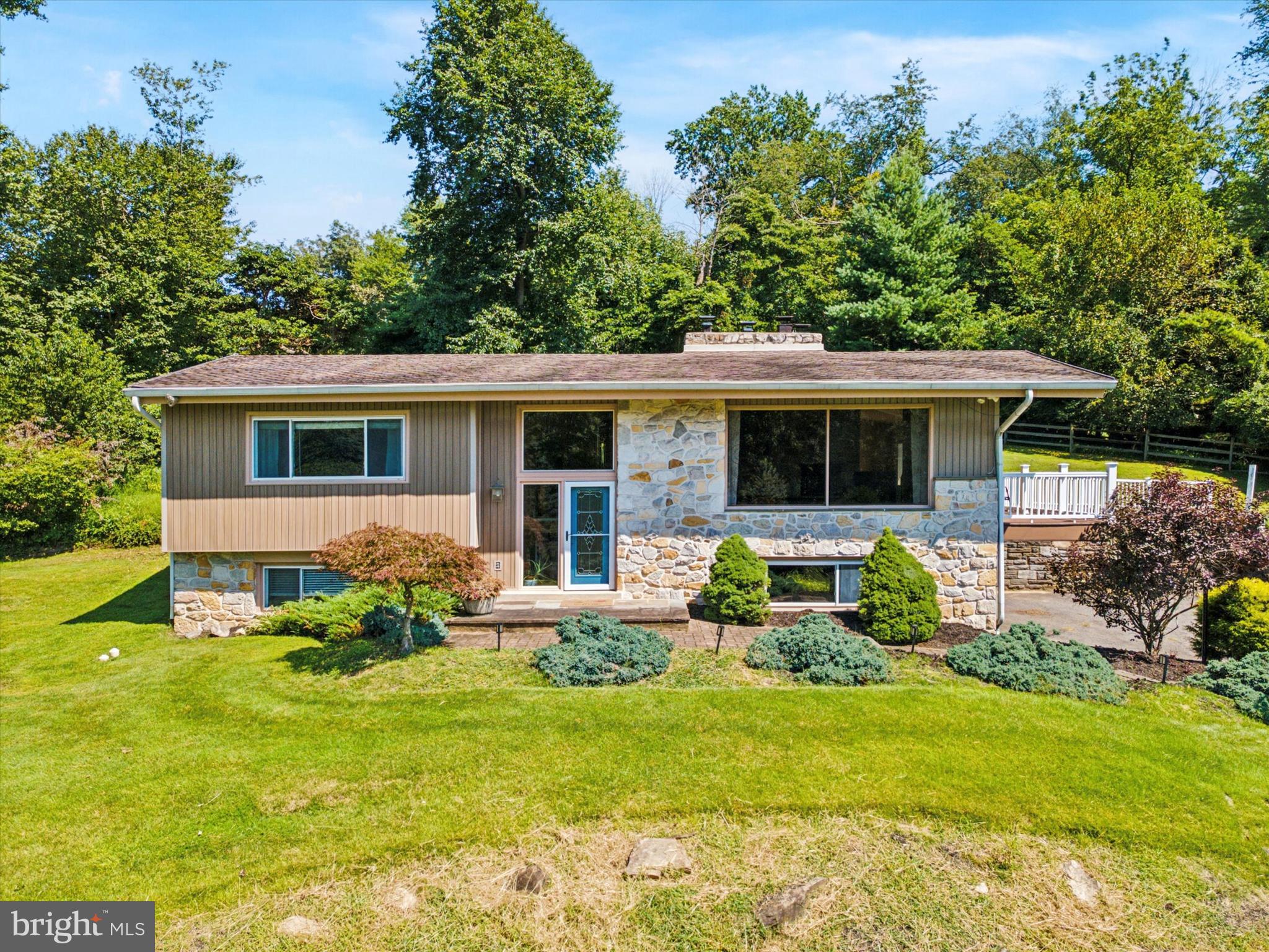 Look at this gorgeous 2,834 sq ft hillside split on a 4.3 acre oasis in Thornbury Twp (West Chester Area School District)!! If serenity and land are what you love and you enjoy a big, beautiful open floor plan with cathedral ceilings, amazing views from every window (and many oversized windows), a huge, double sided stone fireplace, a large kitchen with a mega island, an in- ground pool and even a potential for an in-law suite, then this beauty could be the home for you! The cathedral ceilings and hardwood floors are just amazing as you enter the front door. The huge picture window in the front of the home overlooks the gorgeous grounds and the pool. The dining room is wide open to the gracious kitchen and leads you to a lovely balcony overlooking the pool and ground. The kitchen has plenty of countertop and cabinet space and a beautiful, oversized island and also has sliders to the lovely, serene rear paver patio. There are 2 choices for a primary suite as both bedrooms are generous sizes and have a full bath. A lovely above-grade family room also offers plenty of light and a stone fireplace. The central air is just 2 years new, the pool was painted along with new coping and tile in 2020, and the 2 upstairs full baths were redone in 2019/2020. This home is a retreat and will make you feel like you are on vacation! The pictures really dont do this home justice. Must see in person!
