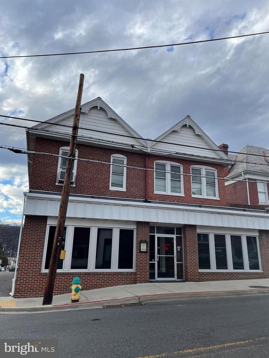 This is the perfect opportunity to ascertain a commercial building at a very reasonable price. There is 1 tenant in unit A upstairs. There is another apartment upstairs or that apartment could be used for the roomy commercial space downstairs as a private conference area and full kitchen. This building conveys with all the attached furnishings downstairs. No personal chattels convey. It is a corner building with parking for at least 8 vehicles or more. Double entrance for privacy, security and shelter from the weather. 4 stall commercial restroom on the main level. Very many options for such a small price.

AS-IS Sale. Thank you.