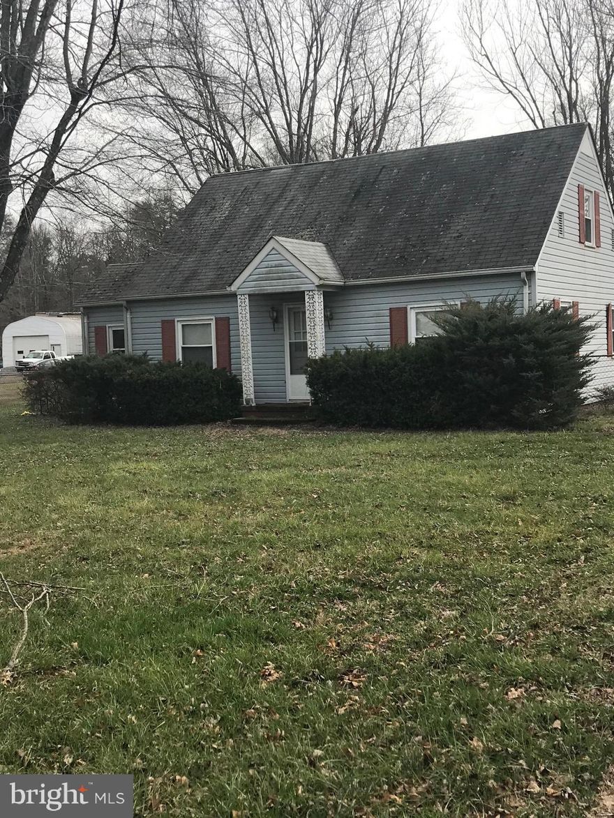 Nice, flat lot in great location just off the 234 bypass and close to the VRE. Newer septic system, covered patio area and exterior building convey. Great school system. Offers will need to be cash or land construction financing. See documents section for septic records. Whole property offered in as is condition.