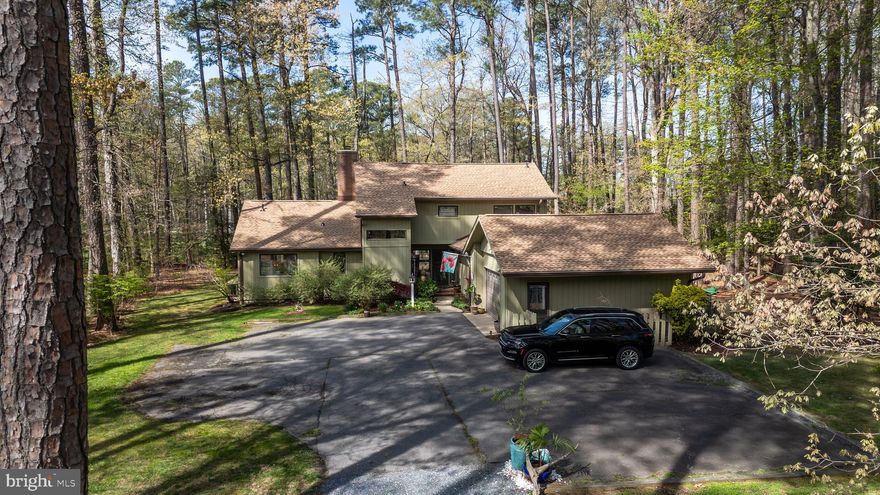 Beautiful four-bedroom contemporary home on a private one + acre lot overlooking the 12th fairway of the Links at Perry Cabin golf course.  Light-filled interior features a vaulted living room with fireplace, spacious family room and dining room and a bright sunroom that opens to a relaxing private deck.  The main-level primary suite includes two walk-in closets and a comfortable layout for everyday living.  Nestled in a wooded setting that provides both privacy and scenic golf course vistas. The two-car garage offers abundant space for hobbies, storage, or workshop.  A wonderful opportunity to enjoy quiet golf course living just minutes from historic St. Michaels, restaurants, shops and the waterfront. Professional photos and floor plans forthcoming.