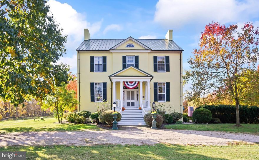 NEW PRICE!  WELCOME HOME TO WOBURN MANOR! Step back in time to a period when manners and elegance permeated society and stately homes dotted the pastoral landscape of Washington county.    Built between the years of  1818-1820, Woburn Manor is the embodiment of history and character.  Once a 1400 acre working estate spanning to the Potomac river in historic Sharpsburg, MD, the property was amassed thru land grant & purchase by prominent Washington county jurist Thomas Buchanan.  As was the norm of the day, each grey stone in this 50+ foot tall, 6,000 square foot creation is sourced from the land, as are much of the original hardwood used for window sashes, flooring and details.  
A tree-lined stone walled lane will take you up to the circular driveway on the now 12 ac farmette.  The manor house was built atop a man made rise to reflect the prominence of it's owner...the stone covered in stucco as was the standard of grand homes at the time.  The lovely front porch , with hand crafted curved banisters, allows for spectacular viewings of the western sunsets over the river.  Note the beautiful fan light and side lights which provide a sunny glow.  
As you enter the home into the front hall, one immediately notices the lovely arch, hand made plaster medallion, 12 foot ceilings & original 200 year old yellow pine floors; the latter which are a feature of the entire home.  The home is federal style thus with a symmetrical floorplan on each level.   The door to your left opens to the cozy front parlor/study.  With one of the homes 8 fireplaces  (4 working) and a large custom made book shelf, it is the perfect room to get away for some private me time or contemplation.  Directly to the south from the hall are the grand parlor/living room & dining room.   The distinctive feature of the living rm is the jib door which leads to a small rear porch overlooking the formal garden.  Large original doors separate the living and dining room spaces; each with their own gas fireplaces.  Added at the turn of the 20th century, a dumb waiter connects the DR w/ the kitchen below (note the old servant's bell near the floor).  To the right from the center entry hall is a side hall.  A beautiful 3 story staircase prominently occupies this space.  Adjacent is the butler's pantry & half bath.  
A door leads downstairs to the more relaxed  "heart" of the family home.  This level features newer recycled pine floors with radiant heat.  The large lower level main hall provides one with many options for use.  Off this hall are the roomy family room & kitchen.   Note the depth of he windows...the craftsmanship and longevity of Woburn can best be seen by the 2+ feet of stone wall that support the structure.  
Your attention in the kitchen is immediately drawn to it's architectural centerpiece...the beautiful (recently revealed) stone fireplace.  The country kitchen provides ample space,  w/cabinetry hewn from trees felled on the property.  A powder room, small laundry  & storage room round out the spaces on this level.  The side door of the "English Basement" opens to the stone walled courtyard w slate patio leading to Summer kitchen & domestic house.  Stone steps connect the courtyard to the formal garden at the rear.
Retracing our steps upstairs, the upper level (3rd fl)  features 3 large BRs, each with fireplace (never used).  In the first to the right, the owner created a walk in closet w built ins. The 2nd BR features original closets to Woburn- a rarity for homes of the era.  In the 3rd "the Blue Bedroom" a closet was created & access to the first of 2 full bathrooms on this level.  
The 4th level has 2 more BRs, cedar closet and attic, and a wonderful view down the staircase. 
*Unique to Woburn are restored historic outbuildings - summer kitchen, spring &  domestic houses- the latter a versatile space to enjoy w/friends or perhaps create a cottage/guest house!  *FENCED*  ELECTRIC TO OUTBUILDINGS*
Subdivision potential- CALL COUNTY