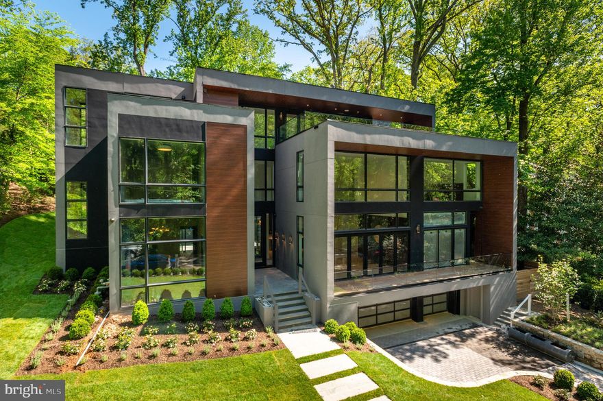 Premier New Construction by Coba Properties! Contemporary 10k+ SF Residence on a private and serene cul-de-sac with unparalleled views of Soapstone Valley directly across the street. Incredible scale with 10'+ ceilings on the Main Level with Custom Designer finishes throughout. The Impressive two-story Family Room with floor-to-ceiling park views opens to the Gourmet Chef's Kitchen with Thermador and Wolf appliances. The main level walks out to the rear patio with Outdoor Kitchen and Swimming Pool. The second level begins with 2 Bedrooms with en suite Baths and continues across a bridge lined with glass panels across to the Primary Suite with park views and a lux Primary Bath with walk-in shower, soaking tub, and 2 vanities; as well as a spacious walk-in closet. The Third Level includes a 3rd Bedroom with en suite Bath and private Roofdeck; and a Recreation Room with Kitchenette that walks out through nano glass doors to the roof deck with 180-degree views! The Lower Level includes a 2nd Recreation Room with Kitchenette, Fitness Room, Bedroom with en suite Bath, Laundry Room with pet shower, and a Mudroom that leads to the 3-car Garage. There is an elevator that services all levels.