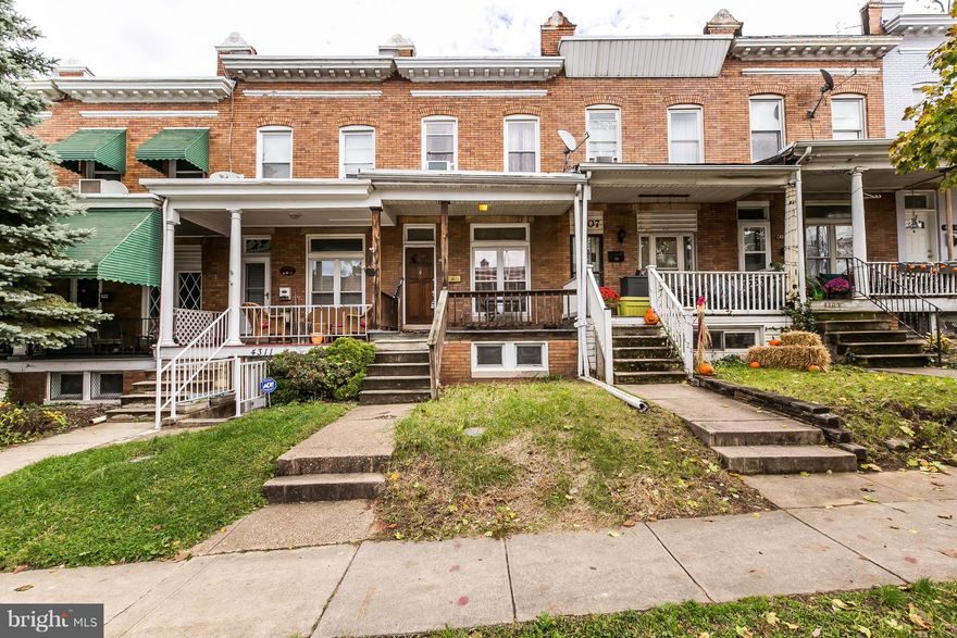 Extra roomy 13 ' wide row home has beautiful original hardwood floors and 9' high ceilings, and OFF STREET PARKING. The basement is finished nicely with a private room, and a den, plus storage. The kitchen is huge, and workable as it stands or could easily be the kitchen of your dreams. The property  is being sold " as is" but with a little love this can be a fantastic home at below market pricing. Walk to all the hot spots in Hampden and Roland Park.