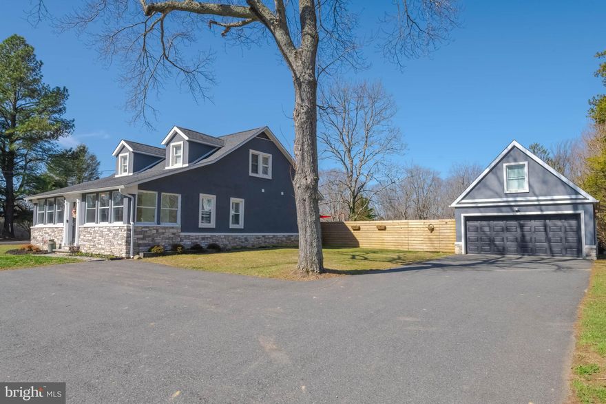 Hot Property Alert in Fallston- Harford County.  Welcome to 2828 Harford Road. Conveniently located just north of the Baltimore/Harford  County line.  Situated on 1.10 acres, this beautifully maintained 3-bedroom home with a main-level primary suite offers the perfect blend of comfort, style, and space.  The heart of the home is the updated kitchen, showcasing quartz countertops, custom cabinetry, stainless steel appliances, tiled backsplash, recessed lighting, pendant lighting, and a center island that flows seamlessly into the dining area.  Relax in the living room with luxury vinyl plank flooring, gas fireplace with mantle, plantation shutters, and six windows replaced in 2025 (with transferable warranty), bringing in abundant natural light. The main-level primary bedroom features engineered hardwood flooring, a walk-in closet, and a stunning private bath complete with a walk-in shower with tiled inset, dual vanities with quartz countertops, and ceramic tile flooring.  Additional main-level features include a sun-filled 30' x 8' front porch sunroom, mudroom, half bath, and convenient first-floor laundry. Upstairs you'll find two oversized bedrooms  with excellent storage and a spacious full bath featuring a separate soaking tub, tiled shower with bench seat, dual vanity with quartz countertops, and custom blinds. The unfinished lower level provides excellent storage and houses the home’s mechanical systems.  Step outside and enjoy the fully fenced rear yard, concrete patio, hot tub, and firepit area—perfect for relaxing or entertaining. The property also includes a 22 x 19 detached two-car garage with additional storage loft and plenty of parking.  Located within the Youth’s Benefit Elementary, Fallston Middle, and Fallston High School district.  Schedule your showing TODAY!