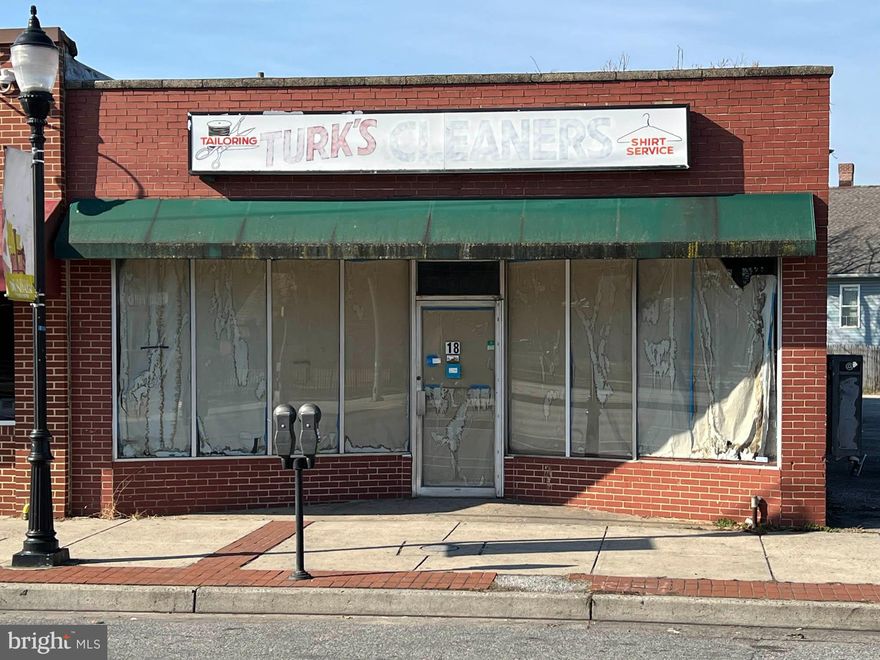 REAL ESTATE AUCTION featuring ON SITE and SIMULCAST ONLINE BIDDING!! Online Bidding Opens - Monday, March 25, 2024. Live On Site Auction - Tuesday, March 26, 2024 at 12:00 Noon. List price is opening bid only. One Story Brick and Concrete Block Commercial Building, built in 1962, containing 2,500 square feet of gross building area, according to public tax records. The building has an aluminum storefront with show windows, built-up roof and front and rear entrances. An attractive mural of Dundalk is painted on the side of the building, facing a large public parking lot.

The building is in shell condition and comprises open span space with unfinished concrete floors. The current occupant was in the process of remodeling the space into a nail salon. Plumbing has been installed along the south wall of the building. There is new electric wiring, aluminum studding and three new 2.5 ton roof-mounted electric HVAC units. The work is not complete and the roof is leaking. The location is excellent and the building has good potential for a variety of retail or service uses.