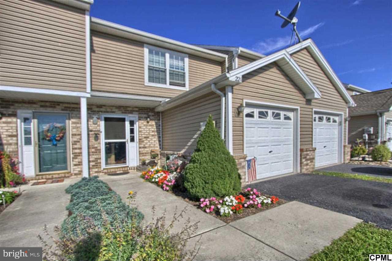 Delightful townhome with patio and fenced yard. Open the front door and enter a surprisingly large living room with upgraded flooring. Spacious eat-in kitchen and 2 large bedroom suites on upper level, each boasting a full bath. Convenient upper level laundry. New carpeting on stairway. USDA financing available. Home warranty included for buyer "Peace of Mind".