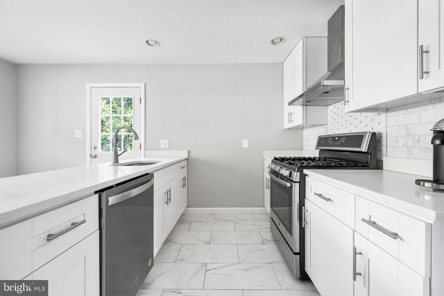 MODERN STONEWALL MANOR SHOWSTOPPER NEAR METRO, MOSAIC & TYSONS

OPEN HOUSE, SATURDAY, DEC 6TH 11AM-1PM. Beautifully updated split-foyer home in sought-after Stonewall Manor, set on a quiet, tree-lined street less than 1.5 miles from Dunn Loring Metro. 

The main level features refinished hardwood floors and a bright, open layout. The renovated 2018 kitchen includes quartz counters, a designer tile backsplash, custom lighting, and stainless steel energy-efficient appliances. The living and dining areas flow seamlessly, creating an ideal space for everyday living and entertaining.

The bedroom wing offers a serene primary suite with dual closets and an updated en-suite bath with a walk-in shower. Two additional bedrooms and a renovated hall bath complete the main level.

The walkout lower level provides a spacious family room with a wood-burning fireplace, custom built-ins, and access to the large patio. A generous fourth bedroom is perfect for guests or a home office, along with a full bath and an oversized laundry/storage area.

Major Improvements: brand-new roof (2025), full kitchen & bath renovation (2018), HVAC (2015), water heater (2022), refinished hardwoods, fresh interior/exterior paint (2024), and all-new designer lighting (2024). No HOA. Some rooms are virtually staged.

Minutes to Mosaic District, Tysons, the W&OD Trail, major commuter routes, and highly rated schools—this home delivers the best of Vienna living with exceptional convenience.