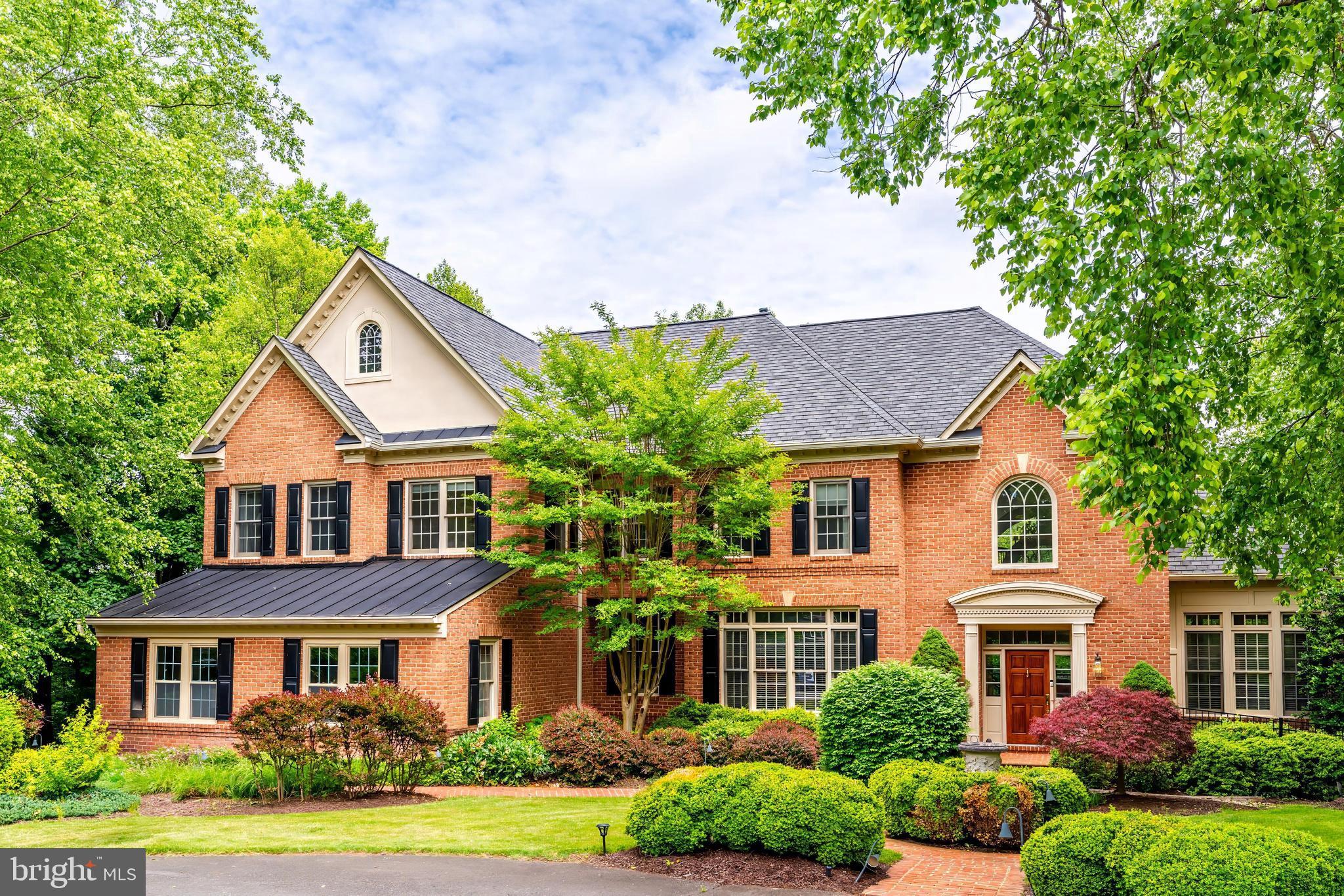 Nestled on a serene 2-acre lot backing onto lush parkland, 891 Chinquapin Road is a stunning
residence offering approximately 8,000 square feet of luxurious living space. Built by
Renaissance Executive, Estate, and Customs Homes, this brick colonial masterpiece exudes
detailed design and craftsmanship, boasting 5 spacious bedrooms, 5 full bathrooms, and 2 half
bathrooms across three beautifully appointed levels.
As you step inside, you are greeted by a dramatic two-story domed foyer featuring a sweeping
curved staircase—a perfect introduction to the elegance within. The main level boasts gleaming
maple hardwood floors, a sun-drenched two-story living room with expansive floor-to-ceiling
windows, a bright sunroom, and an expansive dining room ideal for hosting formal gatherings. A
private office with custom oak built-ins and French doors provides a quiet retreat for work or
study. The chef’s kitchen is a culinary haven, outfitted with granite countertops, custom maple
cabinetry, and all accented by ceramic tile flooring. Adjacent to the kitchen is a cozy family room
with brand-new plush carpeting, a masonry fireplace with a striking stone surround, and sliding
glass doors that open to the peaceful backyard oasis.
The upper level is equally impressive, showcasing newly installed wide-plank maple floors. Each
of the three secondary bedrooms features spacious closets and fully renovated en suite
bathrooms. These baths are thoughtfully designed with contemporary touches, including touchscreen mirrors, luxurious Porcelanosa fixtures, and detailed tile work. The primary suite is a
sanctuary, offering soaring cathedral ceilings, a private sitting area, a secluded balcony, and dual
custom-built walk-in closets. The spa-inspired en suite bathroom is a masterpiece, with crisp
marble flooring, dual vanities with touch-screen mirrors, a water closet, a Jacuzzi jetted tub, and
a Porcelanosa frameless glass shower, all exuding sophistication.
The lower level is a dream for entertainers, featuring a cozy movie theater, an expansive
recreation room, a wine cellar, and a fully equipped wet bar. Additional highlights include an
extra bedroom, a full bathroom with a steam shower that doubles as a pool changing room, and a
dedicated exercise room.
The outdoor spaces are equally extraordinary. The property offers a multi-level retreat with a
brand-new screened-in maintenance-free porch, a brand-new composite deck and railings, a pool,
a flagstone patio, and beautifully manicured gardens. The home provides serene views of Rocky
Run Creek, enhancing its tranquil ambiance. The property also includes a three-car attached
garage, ensuring ample parking and storage. Located in the prestigious McLean Falls at
Chinquapin neighborhood, this home combines serene living with easy access to nearby
attractions such as Great Falls Park and Tysons. With convenient access to Leesburg Pike, Old
Dominion Drive and Georgetown Pike, this extraordinary property offers a rare opportunity to
enjoy a private oasis with unparalleled accessibility.