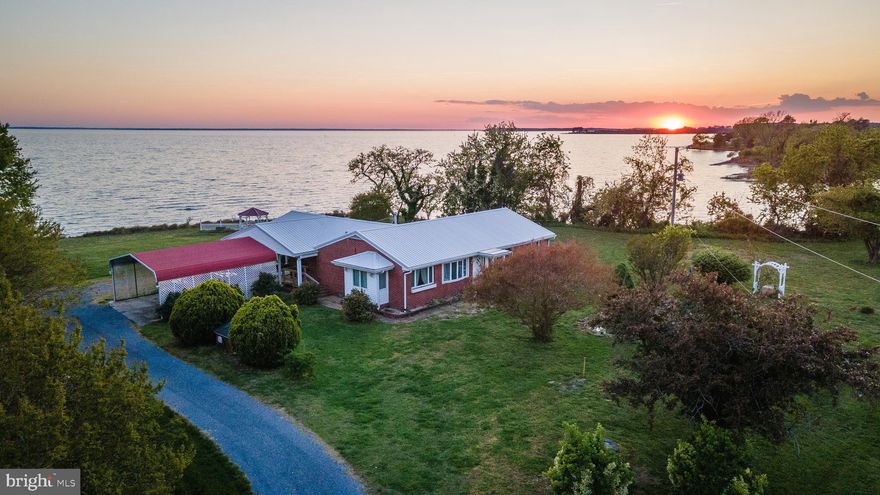 Enjoy panoramic sunset views with waterfrontage on both the Potomac River and Calvert Creek. Lovingly owned by the original local family for over 50 years, this solid all-brick home offers timeless charm with replacement windows and a durable metal roof.

The spacious, functional kitchen features abundant cabinetry, making it ideal for preparing meals and hosting family gatherings. Situated on 2 private acres, the property boasts approximately 200 feet of riprap shoreline on the Potomac River and more than 800 feet of frontage on Calvert Creek.

This exceptional waterfront setting provides convenient access to nearby restaurants and marinas by both boat and car. Spend your days boating, crabbing, oyster harvesting, and fishing right from your own property while taking in the incredible waterfront views and sunsets.