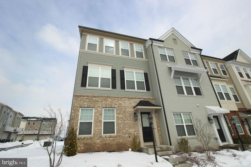 MOVE IN READY! Charming 3 BR, 2.5 BA end unit TH. Open floor plan w/ 2,000 sqft. Gleaming wood flooring t-out main level. Stunning modern KIT w/ large center island, granite countertops, SS apps, pantry, gas, large cabinets. Bright DR & LR w/ recessed lighting & access to balcony. Spacious MBR suite w/ WIC & full BA. BR level laundry. Lower level bonus rec room & 2 car garage. Neutral paint.