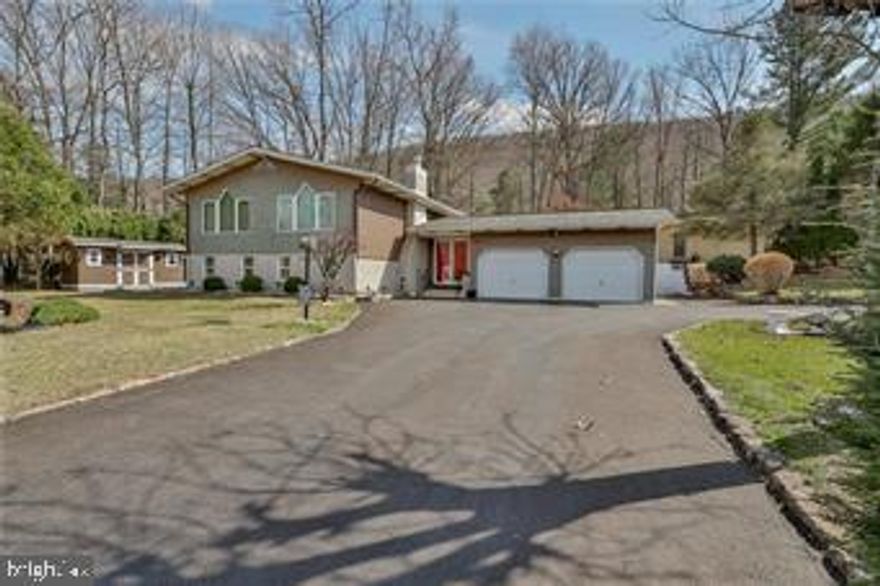 Well maintained home within Hauto Valley Estates Laurelwoods! No HOA FEES! Great location with views of the Nesquehoning Conservation Club pond! Inviting and welcoming! Plenty of parking for multiple vehicles with the extended driveway and two car attached garage! Open foyer with access to the enclosed patio! Two large family rooms one with a propane fireplace and the other provides relaxing views! Open kitchen with plenty of cabinet/storage space and dining room! Convenient laundry room with a first floor full bathroom! Master bedroom with ample closest space and large picture windows with views of the pond! Two more additional bedrooms and full bathroom with soaking tub! Approximately 2,000 square feet of living space! Spacious patio for entertaining! Gracious yard and shed! Public water and sewer! Upper family room could be converted to another bedroom if needed! Minutes from Jim Thorpe, Hiking, Biking and everything there is to love about carbon county! This home has a retreat like setting and is ready for it's next owners!