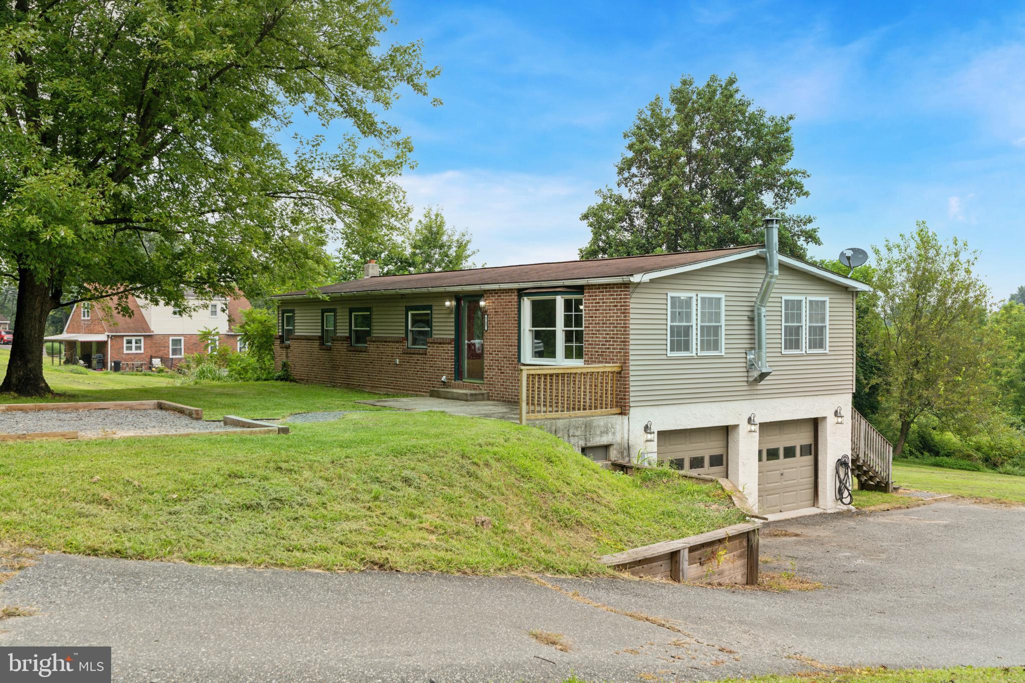Tucked away in a peaceful corner of Douglassville, 747 Chestnut Street offers the ideal blend of privacy, potential, and picturesque views. This 3-bedroom, 1.5-bath single-family home sits on a private lot overlooking the surrounding hills and Daniel Boone High School’s football field—perfect for those who appreciate a quiet setting with a front-row seat to Friday Night Lights. Step inside to a spacious and airy living area designed for entertaining, while still offering a distinct kitchen and dining space for day-to-day living. A charming spiral staircase connects the main level to a finished basement—perfect for a media room, gym, home office, or extra living space. Convenient main-floor laundry adds ease to your routine. Outside, enjoy the functionality of a two-car garage and a shared driveway that leads into your own private parking area—offering both accessibility and storage. While the home could benefit from some cosmetic updates, it has great bones and endless potential. Whether you're looking to put your personal stamp on a property or invest in a hidden gem, this is one worth seeing.