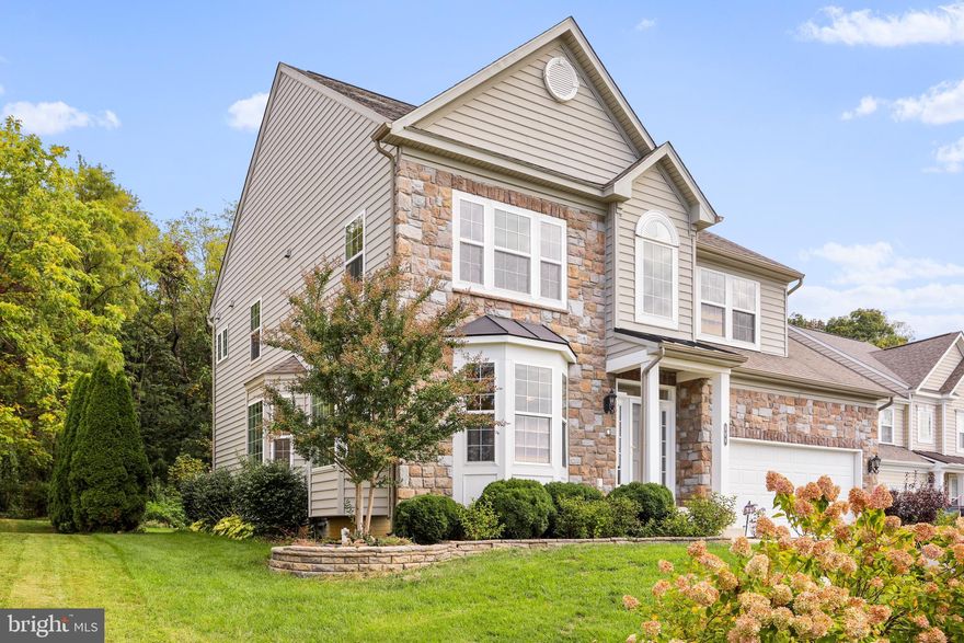 This home is simply fabulous!  Featuring all bump-outs available from builder, home maximizes your square footage and stepping inside, you realize quickly the space available.  Open, light filled rooms featuring multiple bay windows greet you with a sunny hello.  The chef's kitchen with ample cabinets and large pantry, granite, island, built in appliances and more speak to convenience.  The family room located just off the kitchen area is private enough to enjoy, but inclusive enough to not feel removed and features plantation shutters, stone fireplace, and lots of light.  The entire main level features shiny hardwood floors.   Stepping outside into your rear yard featuring a concrete low maintenance patio and hot tub, backing up to the protected wooded area and lined with mature arborvitae  gives you the privacy you deserve after a long day.   The primary suite on upper level is massive and features two walk in closets, changing area, and primary bath with jetted corner tub and large separate shower.  Other three bedrooms are very large with ample closet space.  The entire house is outfitted with whole house Klipsch Speakers, central vacuum, and intercom system.  Stepping on down the wrap-around staircase, you find an amazing finished basement with great room, exercise room, HUGE media room, and full bath with a walk up to the rear yard.  This one is the real deal and you really just might want to paint it with your favorite colors to make it your own.  All carpet has been replaced!  The community is conveniently located off Route 340 in South Jefferson close enough for the Virginia or MD Commuter.  Community has a dedicated maintained walking path surrounding Spruce Hill North and large common areas!