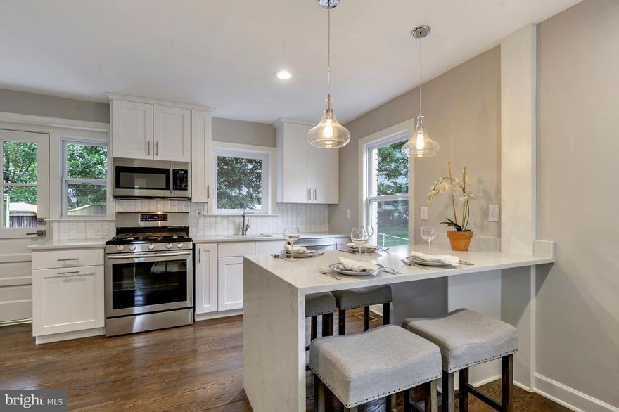 Commuters Dream! Fully renovated duplex in Jefferson Manor! Open floor plan featuring a large new modern kitchen with ss appliances & beautiful marble island. New windows, recessed lighting, plumbing & bathrooms. Warm hardwood floors. Fully fenced yard with new paver patio & detached brick shed. 1 year builder warranty. 495 & GW Parkway. Easy walk to restaurants, shops, parks & Huntington Metro.