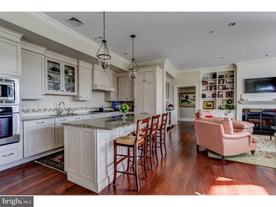 This exquisite 3 BD, 3 BA penthouse condo is located in the BEST location in the building ? with sweeping scenic vistas on 3 elevations and loads of designer upgrades. Ceiling heights are higher than units on the first 2 floors and there are transom windows throughout. All rooms feature neutral walls, recessed lighting, and gleaming wood floors. Two lobbies greet building visitors, while homeowners may enter through their own individual, 2-car garage which is ideally situated near the elevator. A gracious Entrance Foyer w/walk-in closet and full Hall BA leads to the open concept Great Room with Dining Room and Living Room with fireplace, built-ins, and door to Balcony. The Bar Area features glass front cabinets and a beverage/wine refrigerator.  Gourmet Kitchen w/upgraded cabinets, counters, SubZero & Bosch appliances. Sunny Master BD has dramatic views through large windows, including one with an arched top. Expansive Dressing Room with custom closet organizers. Luxurious marble Master BA with soaking tub, frameless glass shower, private water closet, and plantation shutters. BD 2 features neutral walls, plantation shutters, and en suite BA. The 3rd BD has a closet, door to the balcony, and is currently used as a Study. Large Storage Closet is located near the Garage. Airy & expansive 3rd floor views of Wayne and the school playing fields.  Convenient location near the heart of the charming village of Wayne with restaurants, shops, train, movies, schools, all just a short stroll away. Owners have APPEALED the taxes and they should be lowered for 2018.