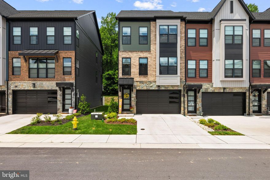 Rarely Available End-Unit Townhome in the Watershed Community – Like New & Loaded with Upgrades!

Welcome to one of the largest Bluemont models in the sought-after Watershed community, built by Craftmark Homes in 2024 and ready for immediate move-in! This expansive 4 bedroom, 4.5 bathroom, 4-level end-unit townhome offers nearly every builder upgrade imaginable, plus premium post-construction enhancements—all in a pristine, like-new condition.

Step inside to find Shaw luxury vinyl plank flooring, oak stairs, and an abundance of natural light, thanks to the end-unit placement and Hunter Douglas custom window shades throughout. The open-concept main level features a gourmet kitchen equipped with Bosch stainless steel appliances, quartz countertops, designer maple cabinetry with soft-close drawers, and a sprawling island with bar seating for four—perfect for entertaining. A stylish side beverage station/bar completes the kitchen area.

The spacious living room boasts a cozy gas fireplace framed by custom built-in cabinets and shelving. Enjoy indoor-outdoor living with a covered back porch ideal for al fresco dining and additionally a paver patio on the lower level offering even more outdoor entertaining space.

This home includes a flexible floor plan with a first floor den and full bath—perfect for a possible guest suite, home office, or media room. Upstairs, you'll find a convenient laundry room near the bedrooms and a luxurious primary suite with custom built-ins in the expansive walk-in closet. Yes, there is even a built-in ironing board! The impressive 4th floor can serve as an additional bedroom suite or an executive home office, complete with a walk-in closet and full bathroom.

Additional highlights include:

Two-car garage with built-in mudroom-style storage

Smart home system for modern convenience

9-foot ceilings throughout

Direct access to the Patuxent National Wildlife Refuge—enjoy miles of scenic trails right outside your door.

Enjoy resort-style living with Watershed’s top-tier amenities, including a clubhouse, fitness center, playground, dog park, and more. All this with quick access to Fort Meade, NSA, Annapolis, Baltimore, and Washington, D.C.

This is more than just a home—it’s a lifestyle upgrade.

Don’t miss your chance to own this exceptional, move-in ready home in one of the area’s premier communities!