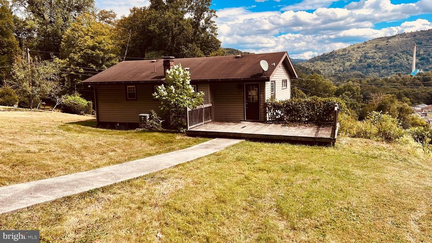 BIG REDUCTION  - Mountain views  - Three bedrooms -  Low maintenance exterior - part finished basement with potential and walks out - Past renovations and upgrade just in need of cosmetics - Rear alley for very convenient access to main level - Large deck off rear - All appliances - Sold AS-IS.