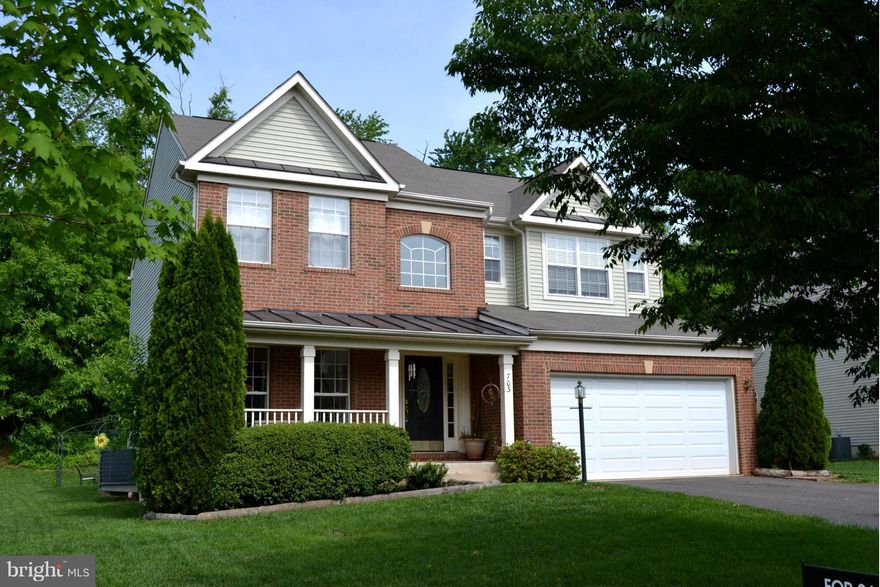 JUST REDUCED - In Town convenience, in popular neighborhood w/ community pool & tennis courts. Brick front colonial that backs up to tree line in the rear.  5 BR, 3 1/2 BA. Large Family room with gorgeous stone fireplace.  Master Bedroom with his/hers walk in closets. Two story foyer boasts hardwood floors.  Basement  fully finished w/ bedroom #5 and a full bath plus a 6th bedroom space set up.