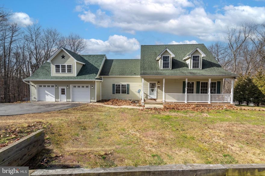 Amazing 5 bedroom 3 1/2 bath cape cod with brand new attached oversized 2 car garage with primary bedroom/bonus room above meant to be the new owner's suite.  The views from the bonus room/primary bedroom are absolutely stunning and breathtaking.  This house truly has it all as it sits on 2 lots totaling over 3+ acres.  Main level bedroom, upper bedrooms, and lower bedrooms.  So a bedroom perfect for everyone.  Gourmet kitchen with island and dining room.  ABSOLUTELY MASSIVE family room perfect for entertaining family and guests.  Thats not all as it also has a heated above ground pool with slide and covered hot tub.  So whether your looking for a primary residence, AIR BNB, or second home.  This checks all the boxes.