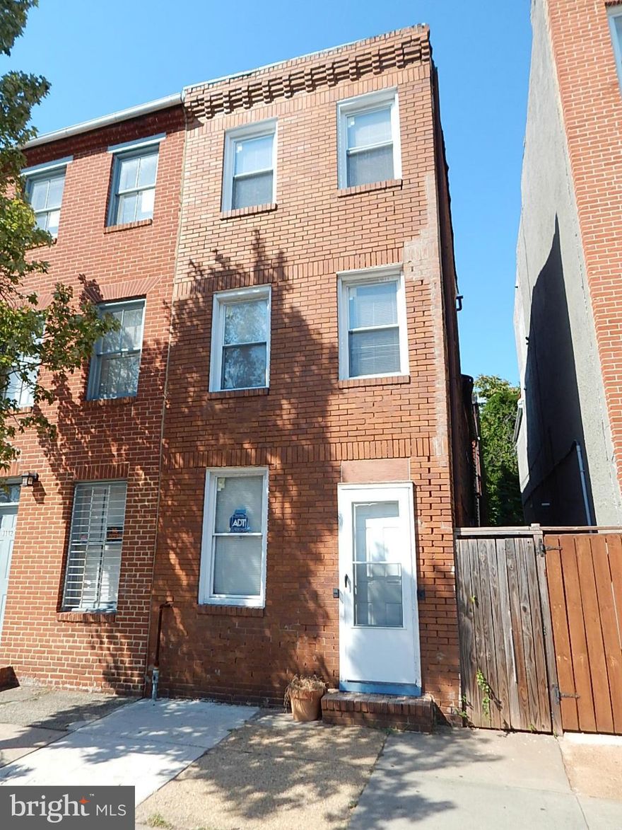 Lots of renovations have been done on this 3 level, 4 BR townhome near downtown, minutes to University of MD, stadiums, Inner Harbor. Walk to Hollins Market and B+O Railroad Museum. Living rm w/hardwood, dining room & updated white kitchen. 2 bedrooms on upper level, 2 bedrooms on top level. Extra rear lot with garage/carriage house. Just needs some TLC.