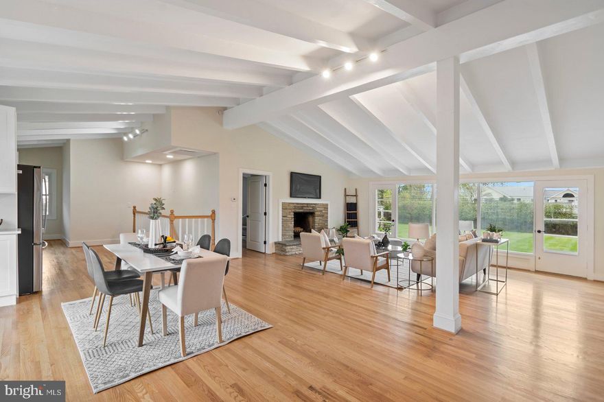 HIGHEST AND BEST DUE BY 6PM ON 4/19/25! Step into this beautifully renovated 3-bedroom, 2 full, 2 half-bath stone rancher tucked away on a peaceful lane in one of Hampton's most desirable neighborhoods. From the moment you walk through the door you’ll love the spacious open-concept layout with soaring vaulted ceilings, gleaming true hardwood floors, and abundant natural light. New windows at every turn. The expansive living and dining area features a stunning stone fireplace and a large picture window framed by glass doors that open to a serene, flat backyard—perfect for relaxing or entertaining. The sunny newly renovated kitchen is a showstopper with quartz countertops, stainless steel appliances, herringbone backsplash and an abundance of cabinet space. Retreat to the spacious primary suite with an expanded updated en-suite bath, plus two additional bedrooms and a stylishly updated shared bath. The fully finished lower level offers even more living space with a large rec room, dry bar and brand-new luxury Berber carpet. Outdoor features include a brand-new patio, a detached 2-car garage with a breezeway, a garden gazebo, and a shed—all on a beautifully landscaped 0.67-acre lot. This move-in ready home blends timeless mid-century charm with modern updates in a location that can’t be beat!