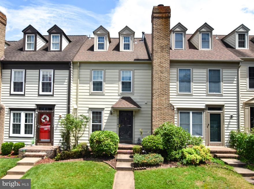 Just reduced!!!Beautiful 4 LEVEL townhouse in sought after Ashburn Village Community which offers everything you need! This freshly painted townhome features gleaming hardwood floors in the foyer,  newer carpeting throughout the rest of the home, and roof was replaced in 2016. .The spacious living room has a fireplace and crown molding adjoining a dining room, next to an eat-in kitchen with ample cabinet/counter space.

From the back sliding doors step out on your beautiful custom deck and fenced in yard with breathtaking views of your own private oasis to enjoy gatherings on warm summers or cool fall evenings with family, friends, or pets! Complete 1st level with a powder room. Then, walk up to the second floor and retreat to either of the two expansive primary bedroom suites with vaulted ceilings, large closets, and a full bath room in each one. The next level loft/ bedroom offers more space with additional storage areas and skylights. The basement features a laundry area, ample storage with flooring and more customizable space – great for a third bedroom and has plumbing ready for a bathroom.

The Ashburn Village HOA has fantastic amenities including the Ashburn Sports Pavilion with a Health Club, Olympic indoor pool, Pier/Doc, Fitness Center. There are also several outdoor swimming pools, Basketball Courts, Boat Dock/Slip, Club House, Common Grounds, Jog/Walk Path, Lake, Party Room, Tennis Courts, Racquet Ball, Tot Lots, Playground, Water/Lake Privilege, Tot lots. The HOA fee also includes Common Area Maintenance, Road Maintenance, Snow Removal and Trash Service. Located minutes from the Dulles Greenway, 1 mile from the W&OD Trail and whether you shop at Wegmans, Target, Costco, Walmart, the Leesburg Outlets, or any other specialty stores, you don't have to travel far. Movie theaters, entertaining nightlife, quality dining, and ample breweries are within an easy drive! This is an ideal location minutes from the Ashburn metro, Ashburn Village Sports Pavilion, several shopping plazas, unlimited walking paths, and much more. This property is ready for you to enjoy.