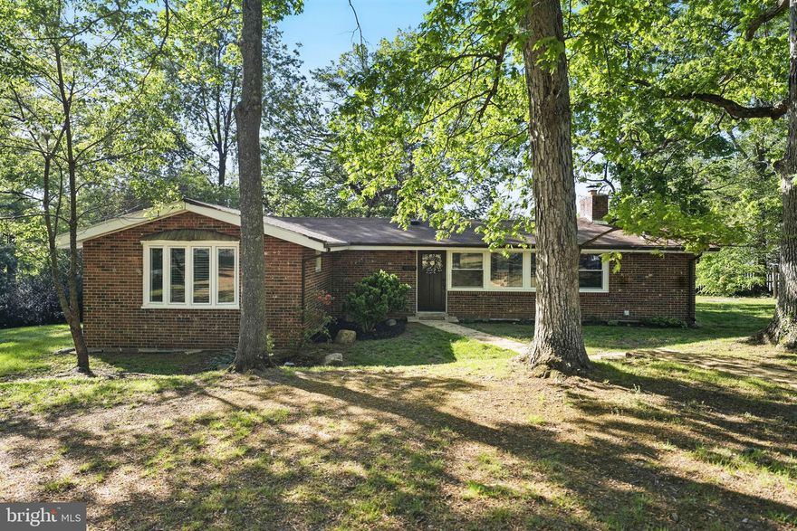 Discover your oasis in this incredible, serene neighborhood nestled within a virtual natural preserve. This updated 3-bedroom, 2-bathroom home offers 1,322 square feet of thoughtfully designed living space on over half an acre (.54 acres) of fully fenced-in land. Enjoy peace of mind with major system updates, including a new roof (2020), HVAC (2018), and water heater (2023).

The gourmet kitchen features sleek granite countertops, stainless steel appliances—including a new range (2022), Bosch dishwasher (2021), and built-in microwave (2024)—as well as a large pantry and cozy eat-in area perfect for gatherings. Solid surface flooring runs throughout the home, complemented by a warm and inviting wood-burning fireplace in the living area.

Deck freshly stained and hardwood flooring refinished (April 2025).

Retreat to the en-suite primary bedroom, complete with vaulted ceilings and charming architectural details. Step outside to a spacious backyard with a deck just off the kitchen—ideal for entertaining, relaxing, or enjoying nature. The oversized shed with electricity provides ample storage or workshop potential.

Additional highlights include an LG washer and dryer, remodeled kitchen, bathroom, and flooring (2016), plus easy access to the Occoquan River and nearby parks and trails, including Meadowood Trailhead, Hidden Pond, Pohick Bay Golf Course, and Camp Wilson.

Located just 3 miles from the VRE and 5 miles from I-95/123, Fort Belvoir, and Dale City, with plenty of nearby shopping, dining, and amenities—this home offers the perfect balance of comfort, convenience, and nature-inspired living.