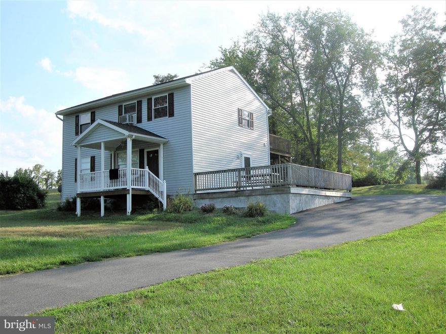 Custom built colonial potential for single family living OR single family living with option to rent one level. This home has two levels, main and upper with each floor having 2 bedrooms, full kitchen and 1 full bathroom. Located on a big beautiful lot, enjoy the privacy on your large deck or front porch.