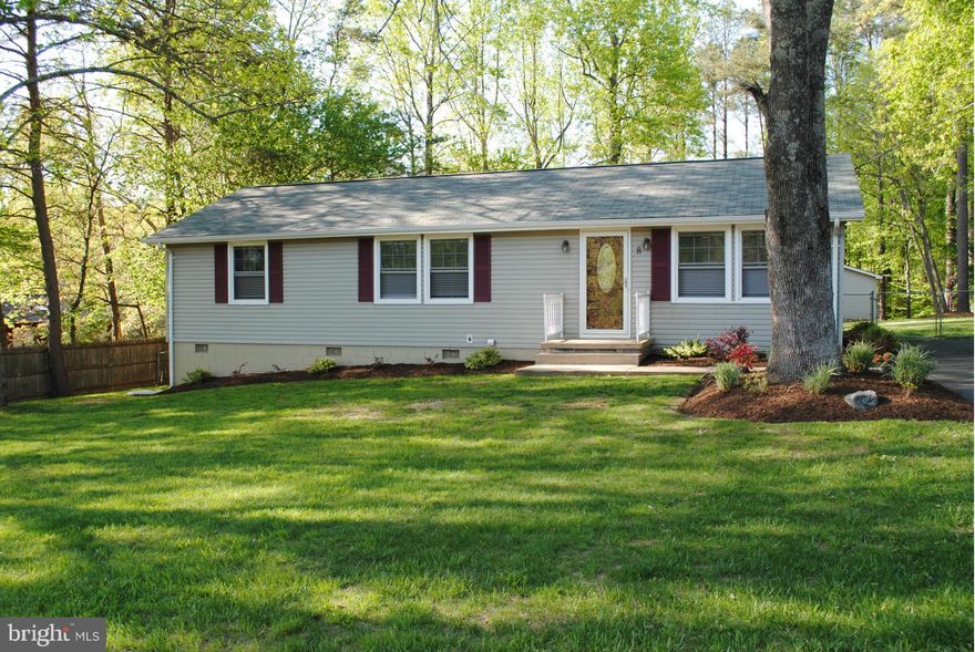 Cute as a button and updates galore! Classic 3 bedroom, 2 bath rambler includes oversized 2 car detached garage/workshop with electric. Newer windows, doors, flooring, roof and deck plus kitchen and baths redone! Level half acre lot is partially fenced. Water filtration system in place. Lake-oriented community close to Quantico, commuter lots and shopping. 30 mi to Manassas. Mountainview HS.