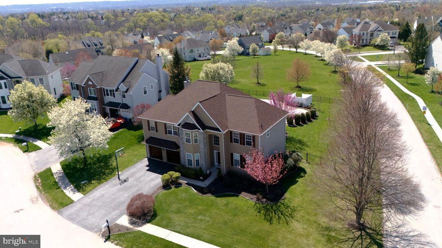 Welcome to this stunning 4-bedroom, 2.5-bath home nestled on a quiet cul-de-sac in the highly desirable Valley High Estates community. Located in the award-winning Methacton School District, this home offers both comfort and convenience—just minutes from   Providence Town Center, local shops, restaurants, and Evansburg Park right next door. Situated on over a third-acre this property provides exceptional privacy and breathtaking valley views. Enjoy your own backyard oasis designed for both relaxation and entertaining, featuring E.P. Henry patio, a fenced yard, heated in-ground pool (installed in 2019) with hot tub, & storage shed. Enjoy unforgettable Summer nights with spectacular fireworks visible for miles. Step inside to a Grand two-story foyer with a split staircase and exquisite woodwork, including custom crown moldings and thick baseboards. The spacious two-story family room impresses with a soaring cathedral ceiling, floor-to-ceiling stone gas fireplace, and large arched windows, all overlooked by a second-floor balcony, which adds to an open architectural appeal. The beautifully remodeled kitchen (2020) is a chef’s dream, featuring 42” custom cabinetry, granite countertops, a ceramic tile backsplash, stainless steel appliances, and an expanded island for additional prep space. Glass sliders lead directly to the outdoor entertaining area. Spacious dining room paired with crisp white wainscoting.  French doors leading to Family Room or possible office, for work at home folks.  The main level also includes a well-sized half bath &  convenient first-floor laundry room which was beautifully reimagined, this space has been expanded to maximize both function and flow, by opening up the original layout, the generously sized laundry room complemented by a versatile mudroom, perfect for keeping daily life organized and clutter free! Upstairs, the expansive primary suite offers two large walk-in closets, a Luxurious bath with soaking tub, Double vanity, and a versatile sitting area ideal for a home office, nursery, or fitness space. Three additional generously sized bedrooms with ample closet space and a hall bathroom with a double vanity complete the second floor. The full basement features 9-foot ceilings and offers endless possibilities!  Home backing to HOA-maintained open space where no future building is permitted, this home combines scenic beauty and modern upgrades—truly a must-see to appreciate all it has to offer.