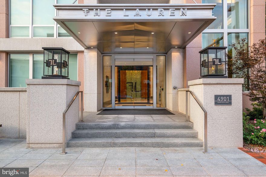 The Lauren is an exquisite luxury boutique building built for the most discerning buyer.  Located at the corner of Hampden Lane and Montgomery Avenue, the location is uncommonly quiet, while still being in the most desirable part of downtown Bethesda.  

Penthouse #701 is truly sublime.  From the moment one steps off the direct-access elevator into their private vestibule, the busy world washes away.  Open the doors and a fantastic light filled space with 10’ ceilings awaits where floor to ceiling glass wrap the perimeter and luxurious amenities abound.   Add the stunning south-west exposure to gorgeous sunsets and you know you're somewhere very special.

Some of the very special features include:  newly installed hard wood wide-width floors; gorgeous chef’s kitchen with newly installed counter top, sink and backsplash, Wolf cook top, Wolf double ovens, Wolf microwave, Thermador wine fridge and Miele espresso machine; stunning open living and dining room with floor to ceiling windows with motorized shades and beautiful custom window treatments, newly installed gorgeous custom built-ins and newly installed fireplace surround; primary bedroom suite with custom headboard, newly installed custom built-ins, sumptuous full bathroom with newly installed counter tops, Water Works sink and plumbing fixtures and two large walk-in closets; two additional generous bedrooms with large full bathroom featuring limestone tile and Water Works sink and plumbing fixtures; lovely powder room with Water Works plumbing fixtures; beautifully appointed laundry room with sink and extra storage; a generous terrace overlooking downtown Bethesda; 2 balconies off the secondary bedrooms and the entire apartment is automated at the touch of a button, which controls lighting, window shades, music, temperature and more.

Resident amenities include:  direct access elevators, private roof-top terraces with catering kitchen and grilling area, the Onyx Lounge which offers a second catering kitchen and is a sophisticated space to host a large event or socialize with other residents, private wine lockers, state-of-the-art fitness center, bicycle storage, large storage locker and 2 assigned parking spaces.

Additional services include:  24-hour white glove concierge, valet parking, package delivery, lock and leave services and on-site management and engineering staff.

Simply put, there is no other building in Bethesda or surrounding areas that defines luxury like The Lauren.
