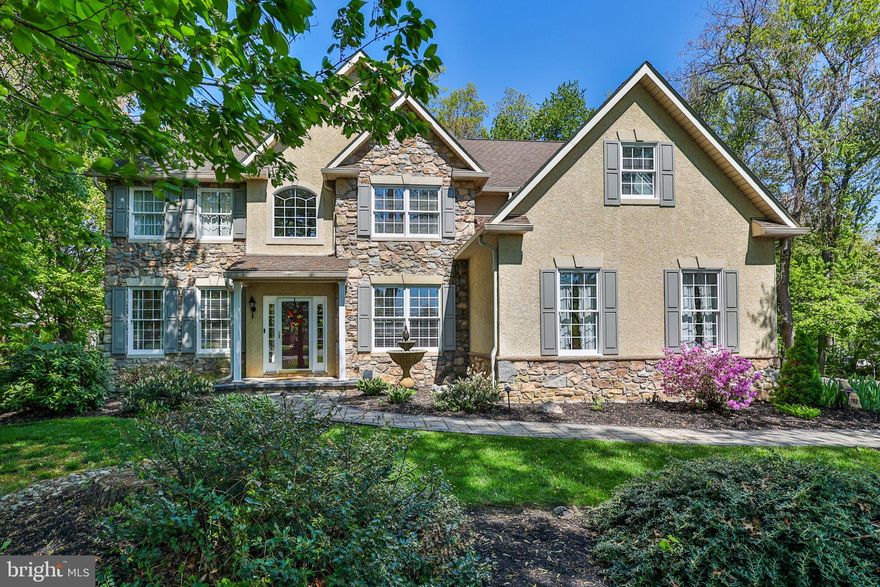 Welcome to this stunning home located in the highly sought-after East Penn School District, nestled on a picturesque, oversized landscaped lot adorned with mature trees and vibrant blooming bushes. Step inside to discover gleaming hardwood flooring throughout the first floor, a grand two-story foyer with a striking catwalk, and elegant formal living and dining rooms. The spacious two-story bright and sunny family room features a cozy gas fireplace, while the modern eat-in kitchen is perfect for gatherings and culinary adventures. A convenient first-floor private office offers ideal remote workspace. The powder room finishes off the first floor. Upstairs, you'll find four comfortable bedrooms plus a versatile bonus room. The fully renovated primary bath complements the expansive primary suite with a walk-in closet, while three additional generous bedrooms share a beautifully updated hall bath. The huge, full unfinished basement is only limited by your imagination. Enjoy seamless indoor-outdoor living with an impressive Trex deck accessible from the kitchen through oversized sliding glass doors, overlooking the lush, private yard with paver walkways and a charming patio complete with a gas firepit. Experience peace and privacy, all within easy reach of local amenities and everything you need.