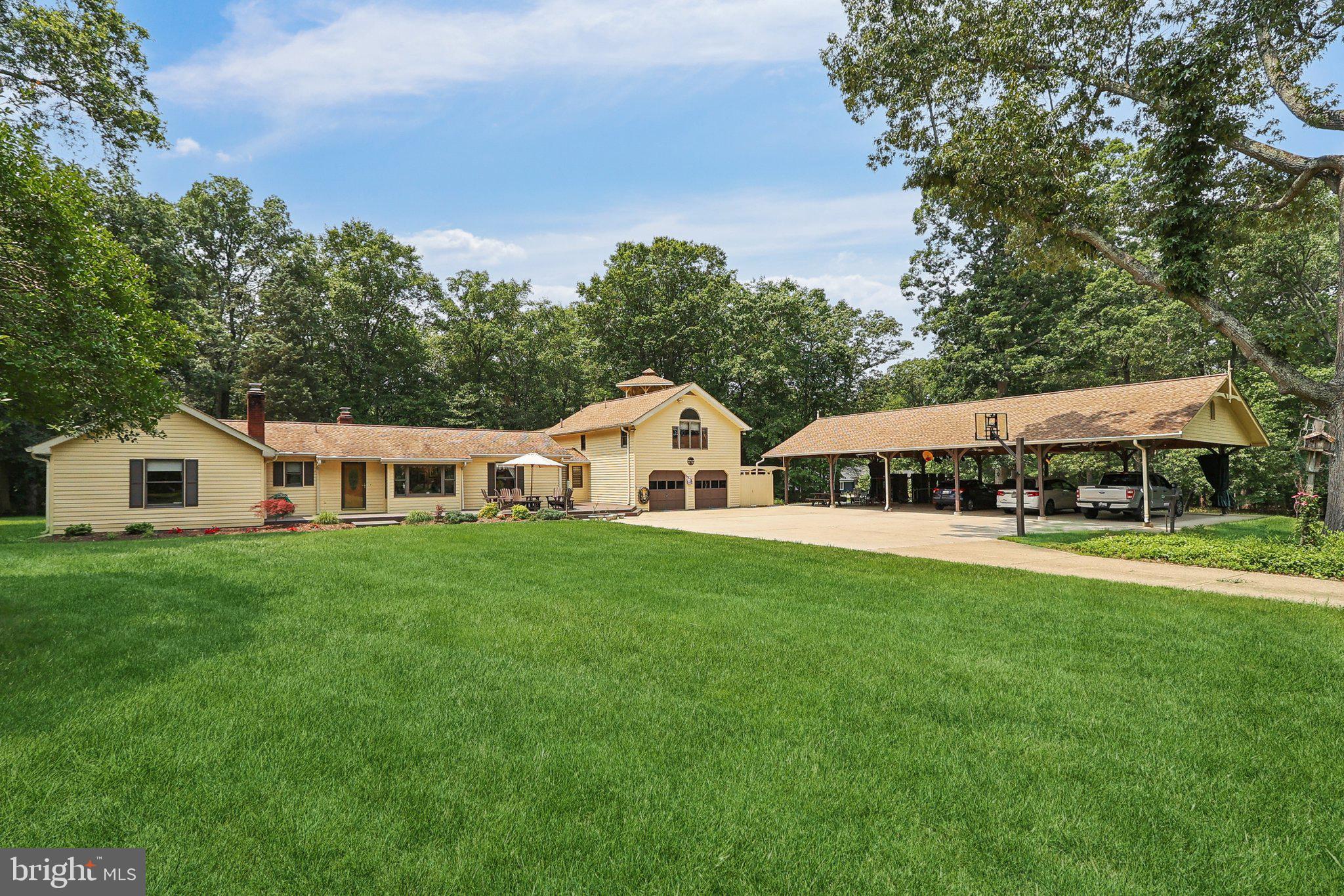 Immerse yourself in the rich history and natural beauty of the esteemed Piscataway Park System with this captivating one of a kind property! Welcome to your own private retreat in Accokeek’s coveted Apple Valley section of the Moyaone Reserve. Set on 6.25+/- acres of open and wooded serenity, this incredibly well-maintained 5-bedroom, 4-bathroom estate blends comfortable country living with unmatched outdoor entertainment potential. From the moment you arrive, you’ll sense the unique energy of this property—thoughtfully updated and meticulously maintained, artfully cared for, and ready for just about anything!
Inside, you’ll find like new hardwood floors throughout the main living areas, a beautifully updated kitchen boasting custom oak cabinetry Corian counter tops and a walkout deck / view overlooking the back yard. Built-in shelving adorns both the Dining Room and Family Room, and the recently renovated bathrooms strike the perfect balance between timelessness and fresh. The main level is anchored by two custom wood burning fireplaces, one is set up with a Wood Stove insert for those cozy evenings and a decorative electric insert within the fireplace of the primary suite. Over-sized Andersen windows bathe the living and dining spaces in natural light, while a separate studio room / study, with its own entrance provides the perfect spot for an art studio, home office, or creative business setup.
Just above the over-sized two-car garage—currently used as a workshop—you’ll discover a charming and generous private in-law suite. Complete with a full kitchen, bedroom, bathroom, and its own 12' x 16'covered deck overlooking the backyard, it’s ideal for guests, multi-generational living, or future rental flexibility.
Pick and choose your venue outside of the home, too many options make it a challenge! Venture outside onto the 24' x 14' deck from the Kitchen for your morning coffee with nature, or opt for the front deck for lively discussions while overlooking scenic views or the meticulous landscaping of the front yard. This property transforms into an entertainer’s dream! A custom-built fort with a 50-foot slide into the woods, a rock climbing wall, Tiki Bar pavilion, a covered patio adjacent to a beautiful stamped concrete 24' x 24' patio with a fire pit, or visit the elevated 12' x 12' observation deck; each creating a one-of-a-kind experience. The Seller has even hosted over 350 guests for an event and celebrations comfortably! The over-sized 24' x 60' Pavilion / Carport provides ample parking, and accessible storage above, or use it's thoughtful layout to make everything from casual gatherings to large-scale entertaining effortless.
The MOYAONE RESERVE, this home stands as a testament to the conservation-minded spirit of its residents. With over 200 homeowners dedicated to preserving the land, you'll enjoy expansive gardens and home sites while relishing in the untouched splendor of the surrounding landscape. As part of the Mount Vernon view shed, Moyaone Reserve is steeped in history, with ties to the storied past of Accokeek. Residents can explore nearby historical sites, such as the Accokeek Foundation at Piscataway Park, delving into the area's multi-generational heritage. With its seamless integration of contemporary comforts and timeless charm, Moyaone Reserve offers a distinctive living experience for those seeking a blend of luxury, community, and historical significance. Your home offers unparalleled tranquility and stunning woodland vistas, riverside farms, and vibrant wetlands. its an idyllic setting, yet you're just a short drive from the bustling energy of Washington, D.C., and The National Harbor.
Located in Prince George’s County’s scenic rural tier, this property offers peace, privacy, and the kind of space rarely found in suburban Maryland. Whether you're looking for a home that inspires, a place to gather, or simply somewhere that feels like a permanent getaway, this is it!